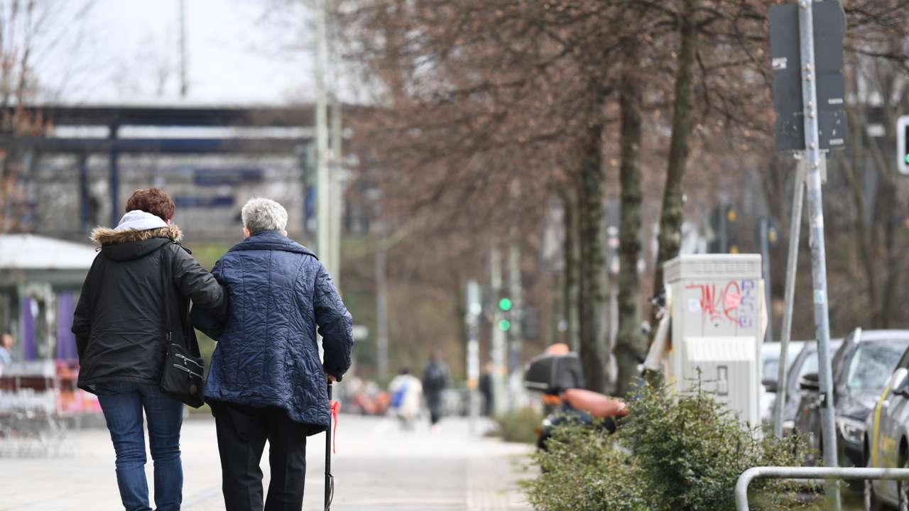 Two elderly persons walk during the spread of coronavirus disease (COVID-19) in Berlin