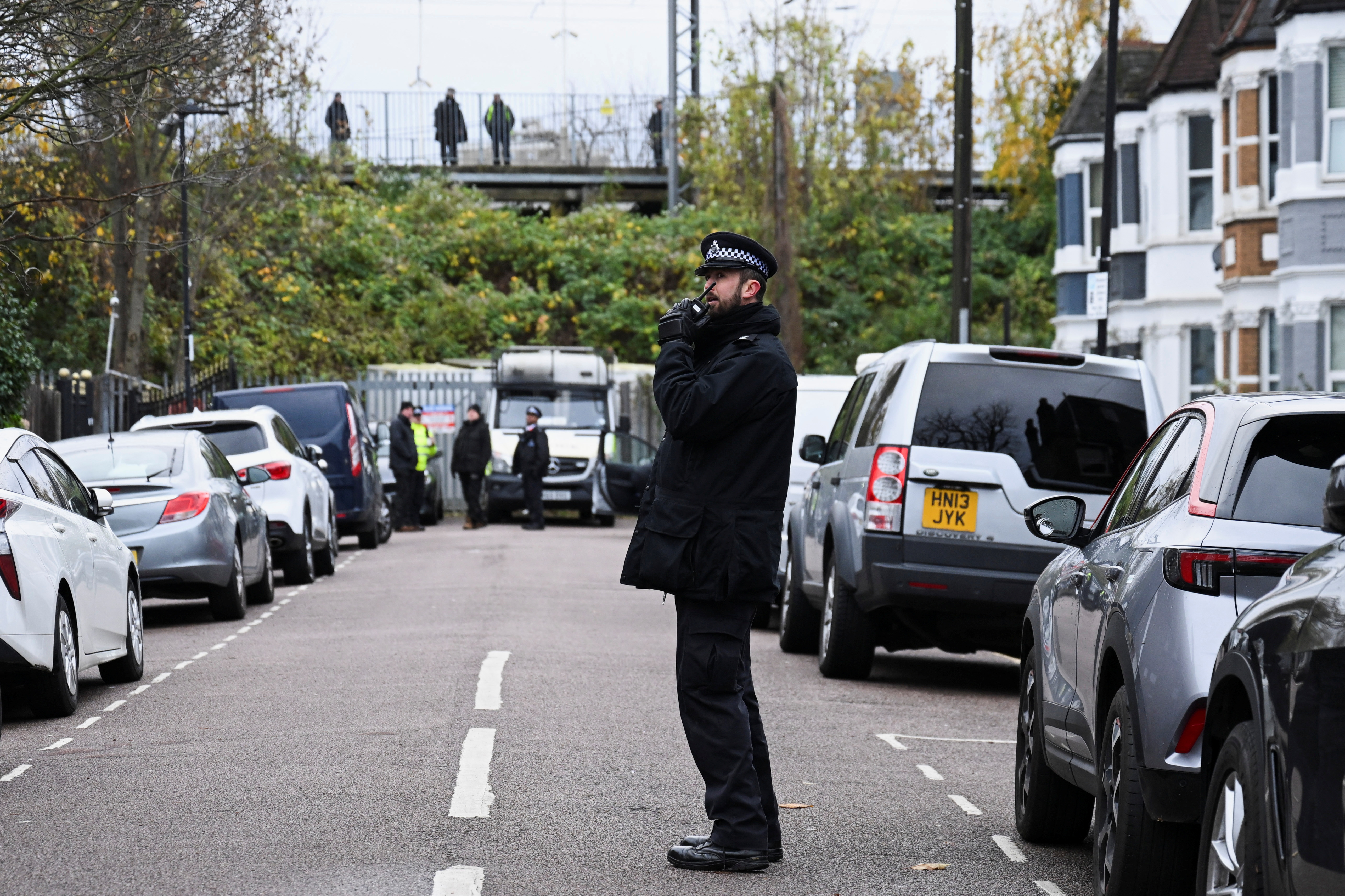 Police stand outside a Kurdish community centre after a counter terrorism investigation into suspected activity linked to the banned Kurdistan Workers Party, in London