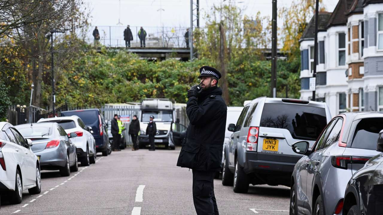 Police stand outside a Kurdish community centre after a counter terrorism investigation into suspected activity linked to the banned Kurdistan Workers Party, in London
