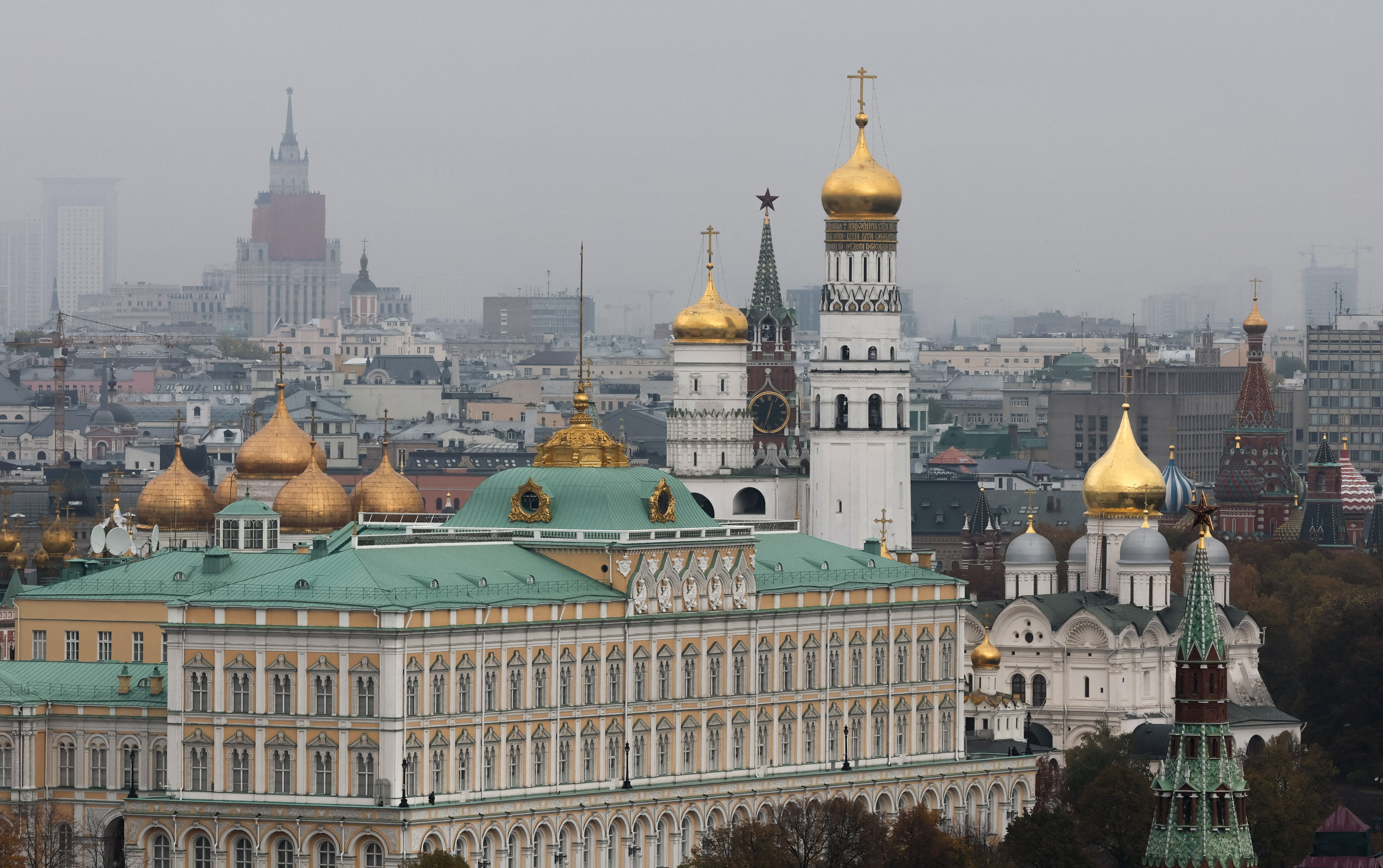 Kremlin's Spasskaya Tower, the Ivan the Great Bell tower and the Grand Kremlin Palace in Moscow