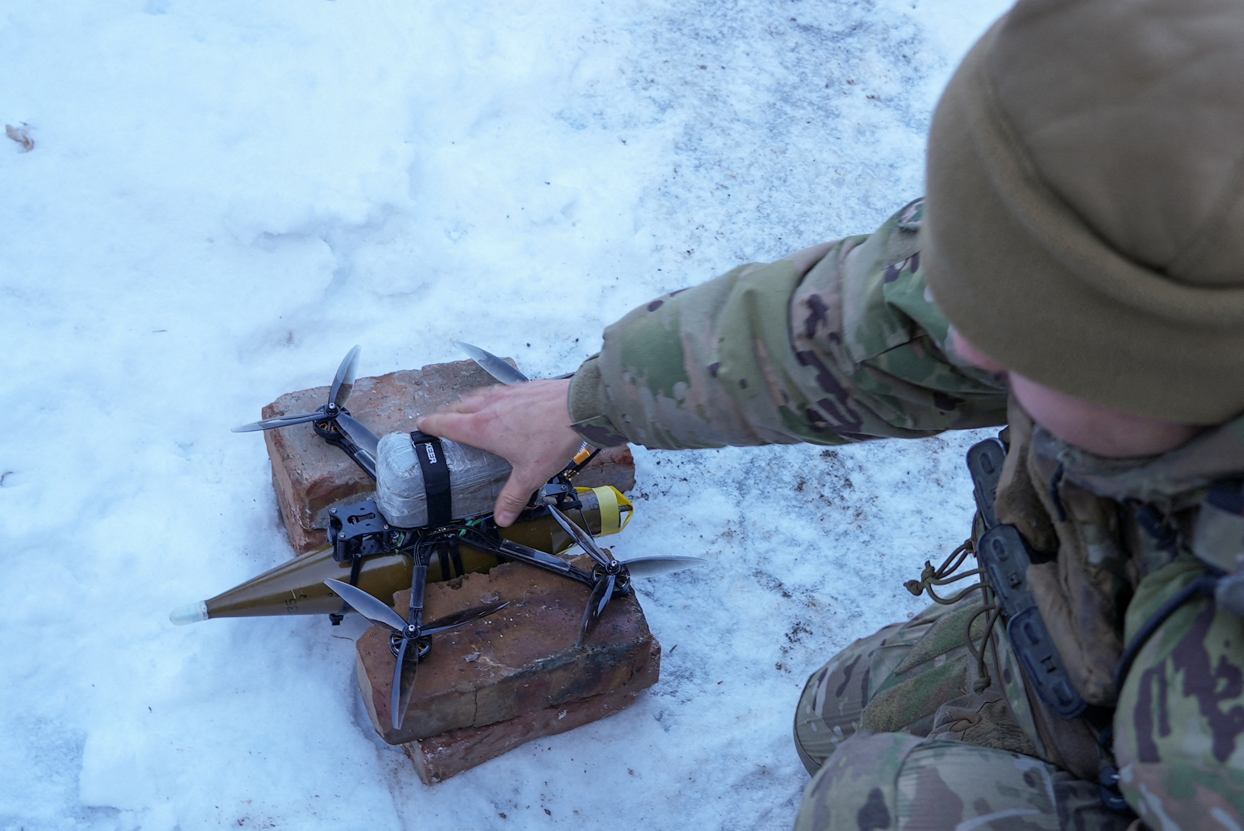 FILE PHOTO: Ukrainian serviceman prepares to fly a first person view (FPV) drone at a position near the town of Horlivka