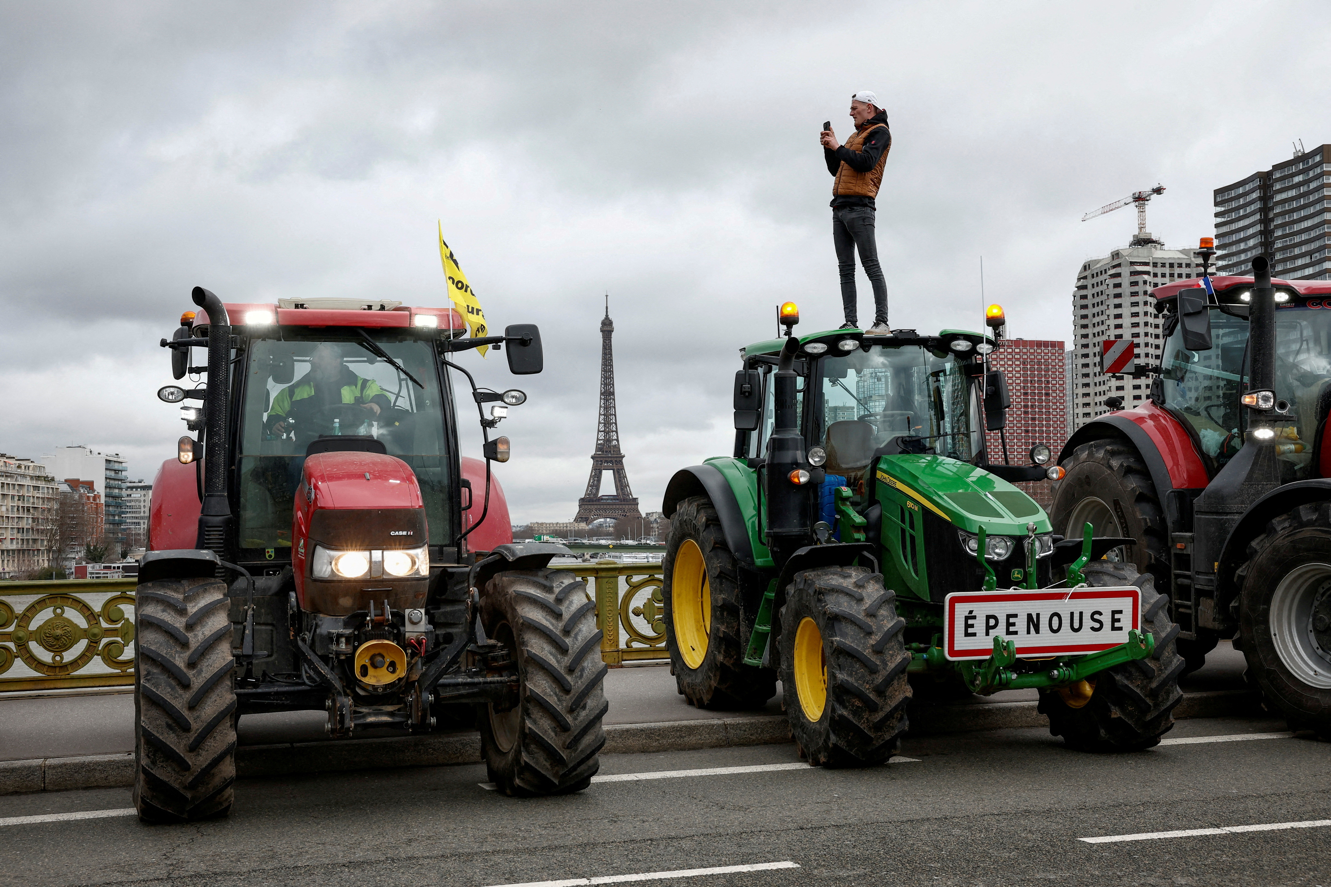 FILE PHOTO: Farmers protest ahead of the opening of the Paris farm show, in Paris