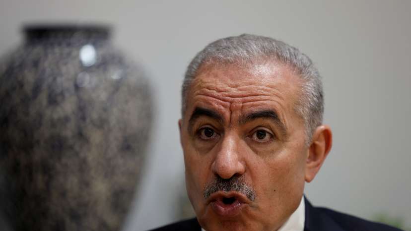 Palestinian Prime Minister Mohammad Shtayyeh speaks to Reuters at his office in Ramallah