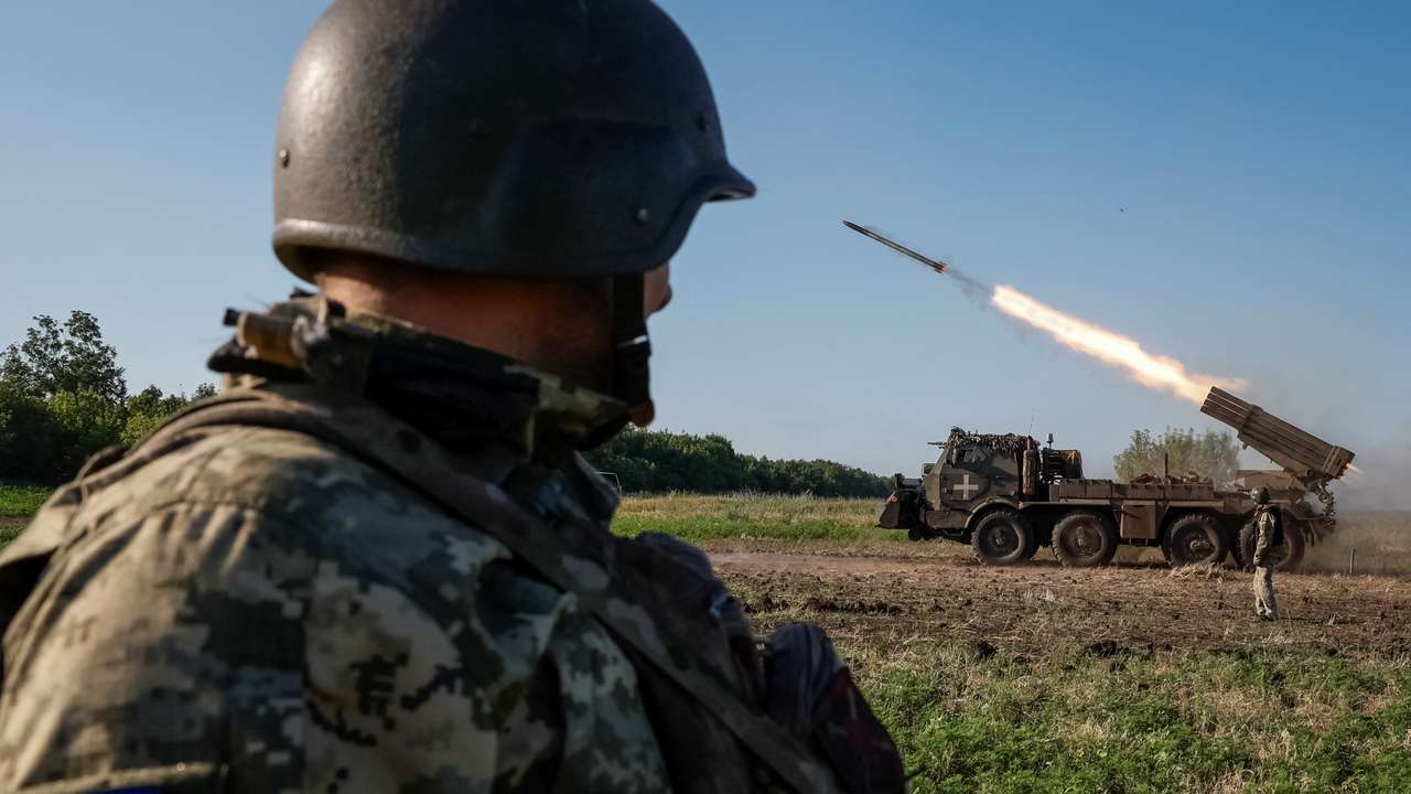 Ukrainian service members fire a RM-70 Vampire multiple launch rocket system towards Russian troops, at a position near a front line in Donetsk region