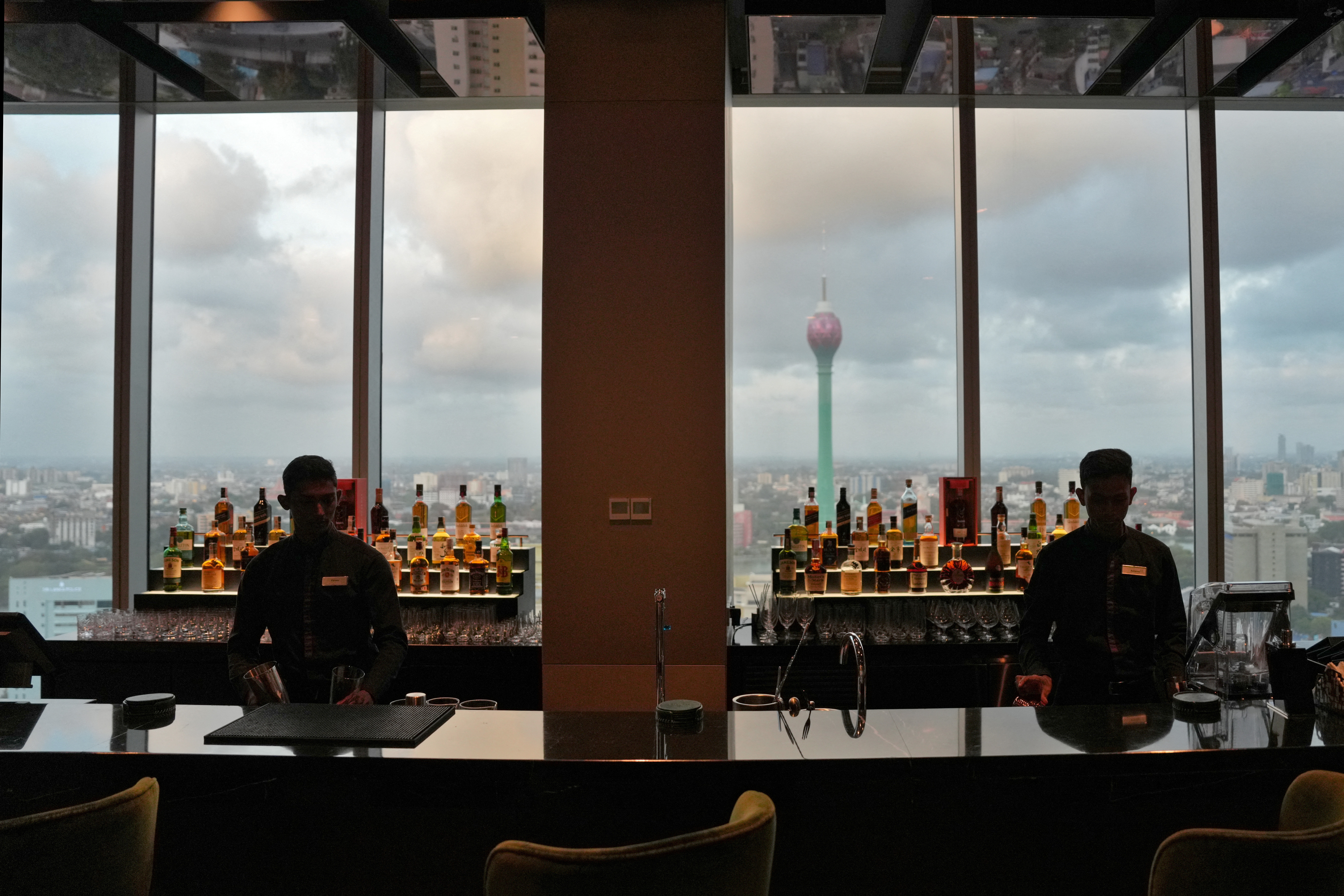 Employees work at a bar in the City of Dreams in Colombo