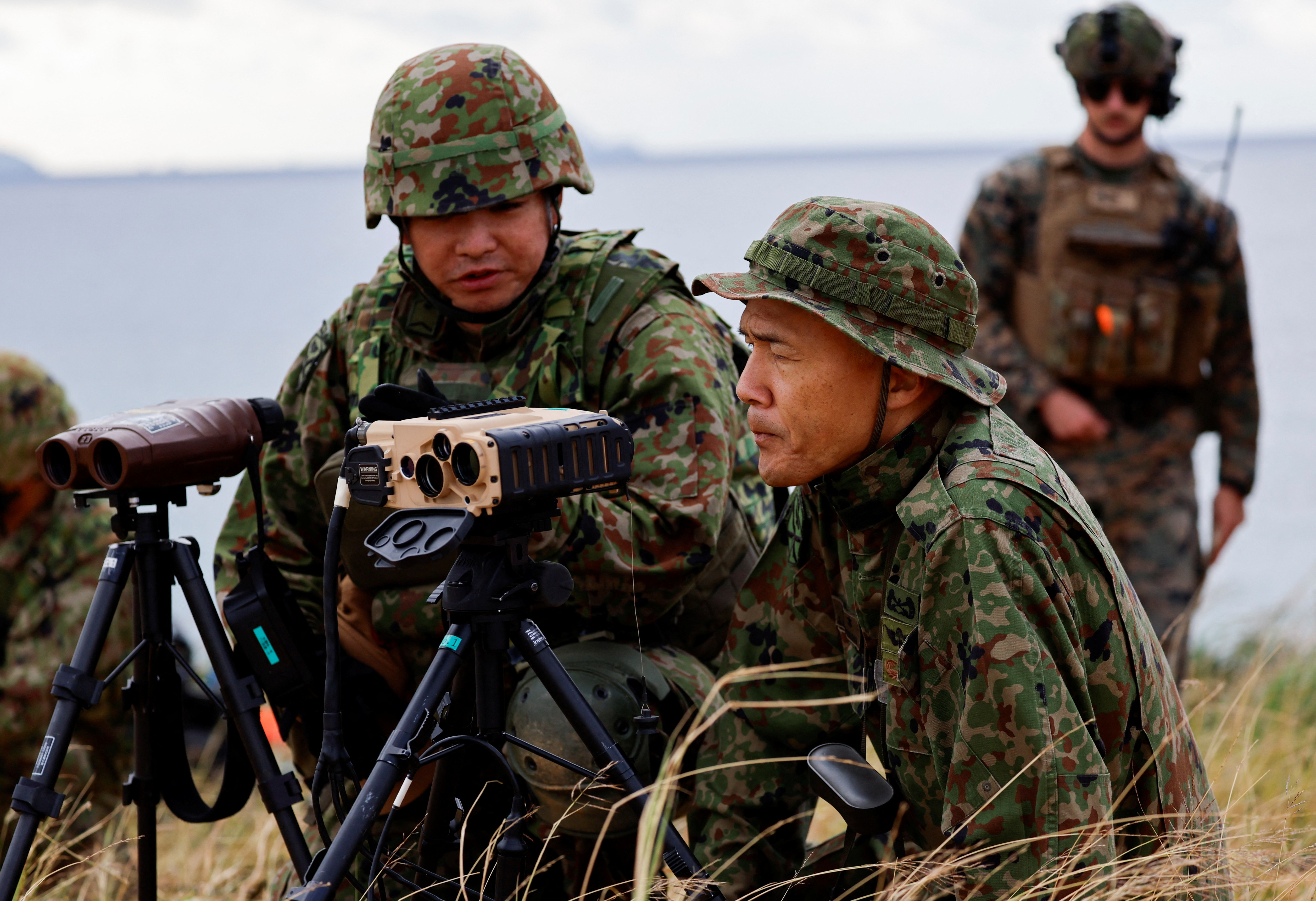 Japanese Ground Self-Defense Force's Amphibious Rapid Deployment Brigade soldiers take part in a military drill at Irisuna island