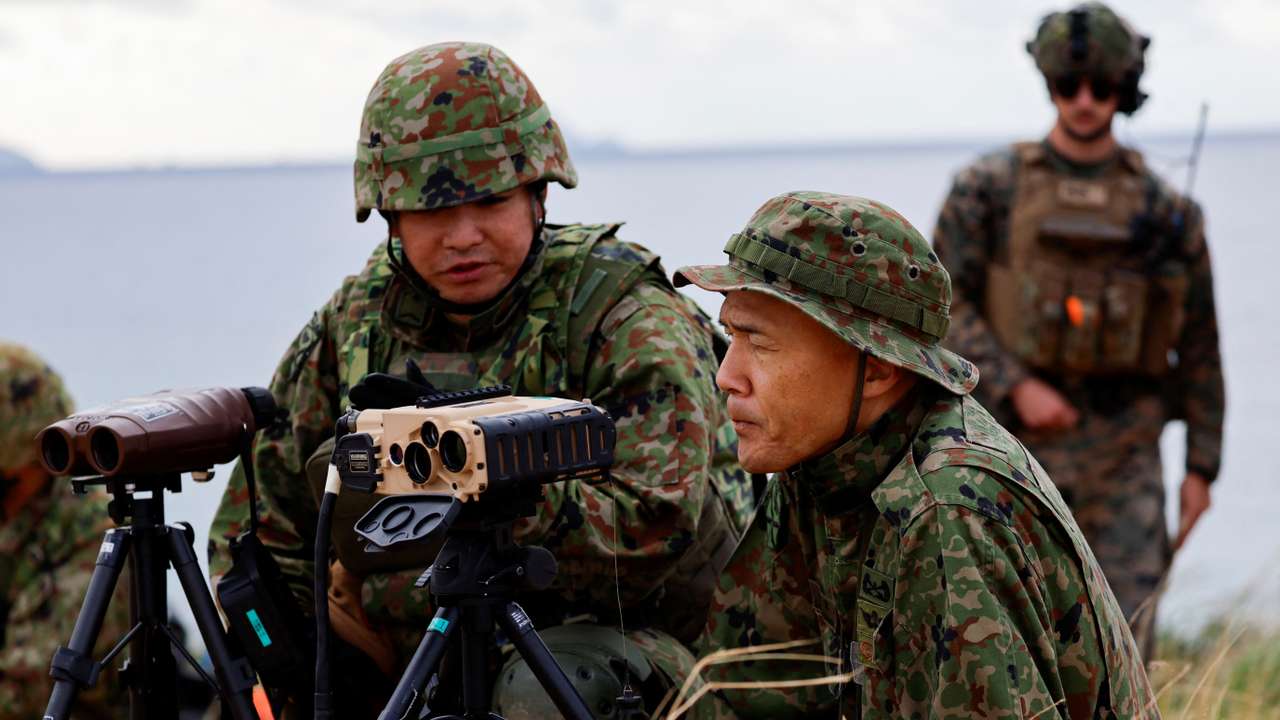 Japanese Ground Self-Defense Force's Amphibious Rapid Deployment Brigade soldiers take part in a military drill at Irisuna island