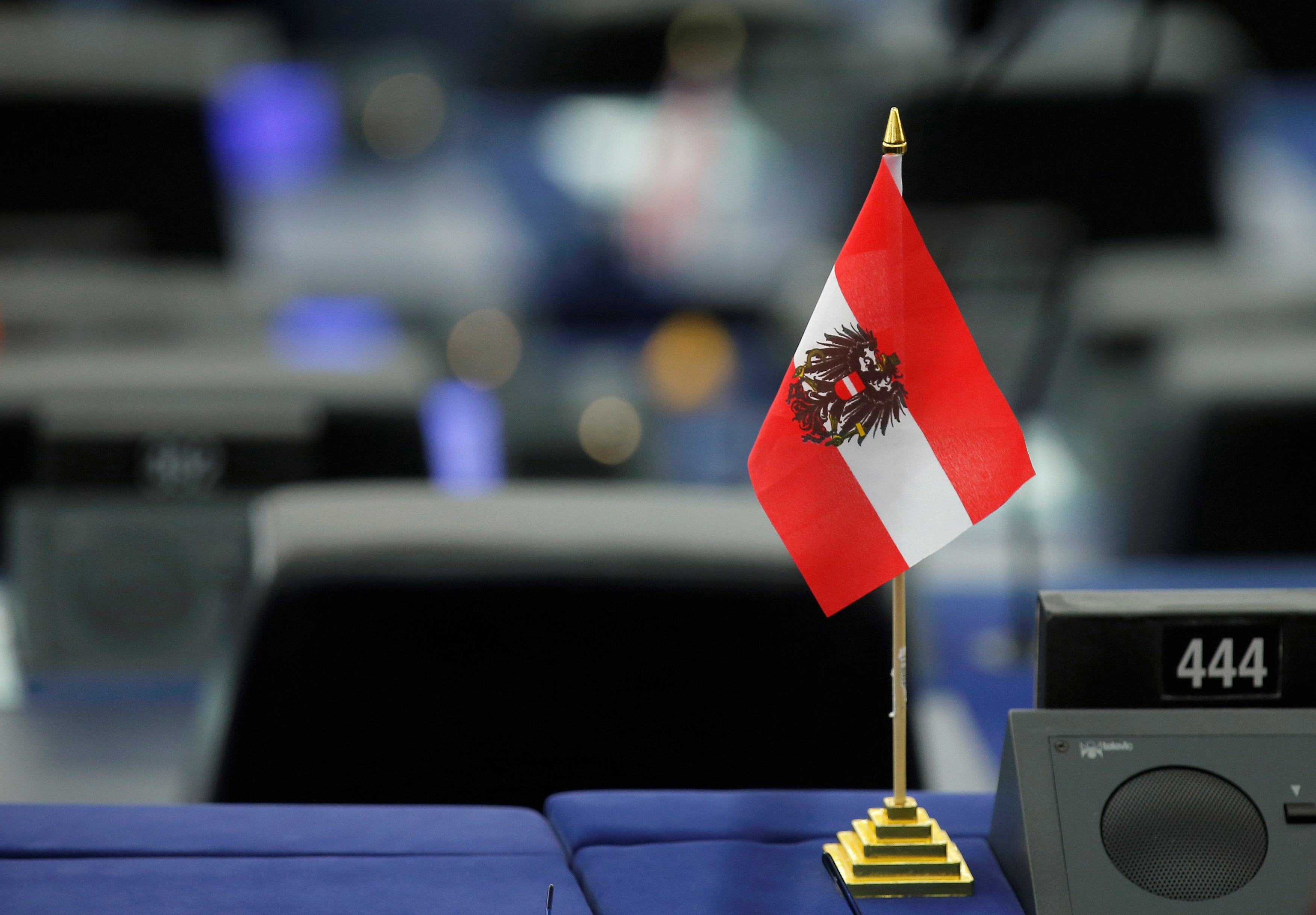 An Austrian flag is seen on the desk of a MEP during a debate at the European Parliament in Strasbourg