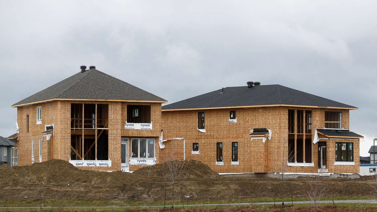 Houses are seen for sale and under construction in a neighbourhood of Ottawa