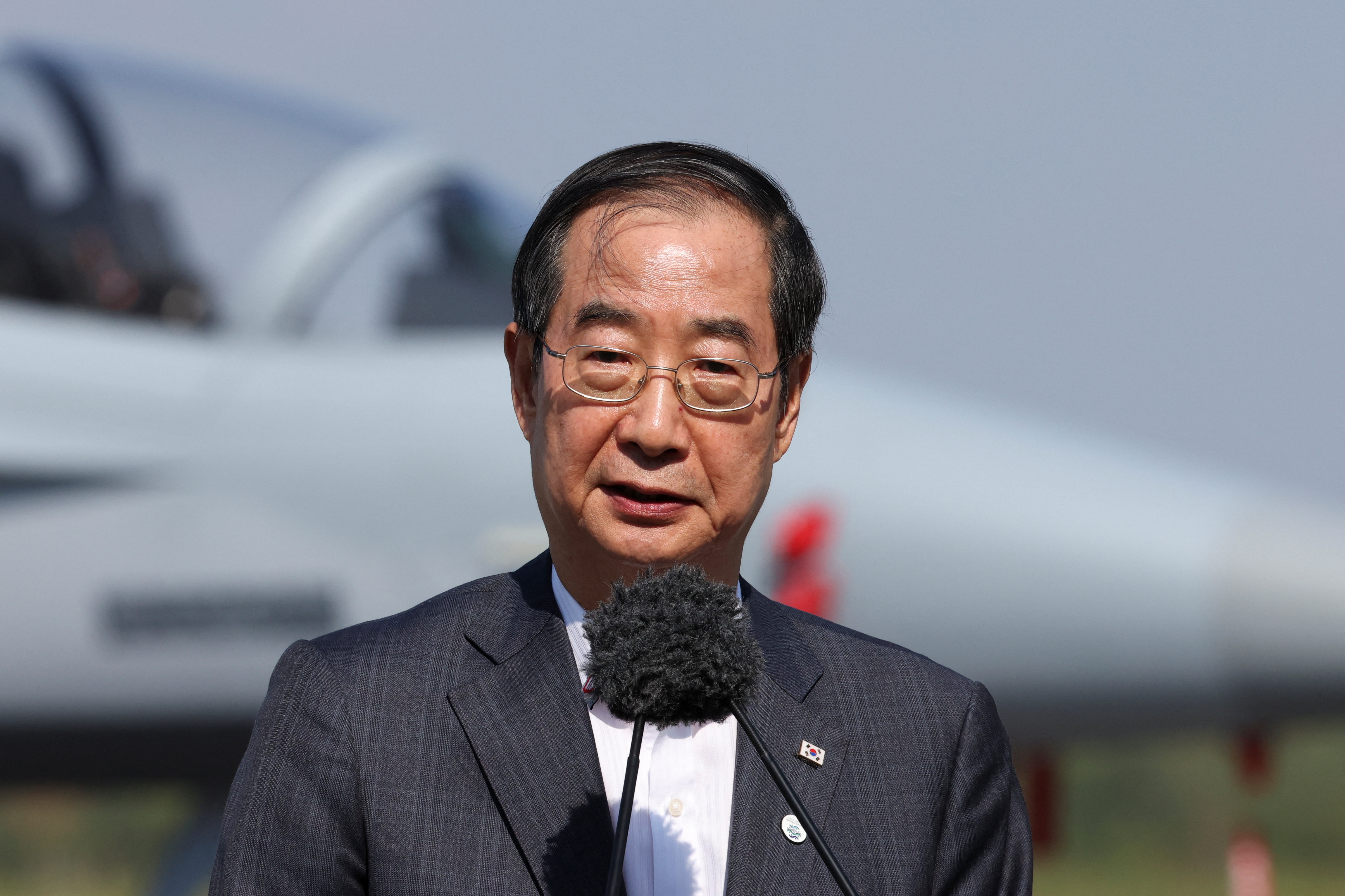 South Korea's PM Han Duck-soo meets Polish counterpart Mateusz Morawiecki at an airbase near Minsk Mazowiecki