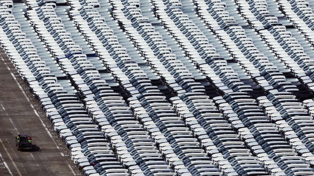 FILE PHOTO: Automobiles unloaded from a cargo ship are parked at Tanjong Pagar container terminal in Singapore