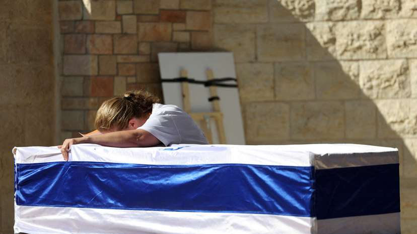 Friends and family mourn during Israeli soldier Corporal Noa Marciano's funeral, in Modiin