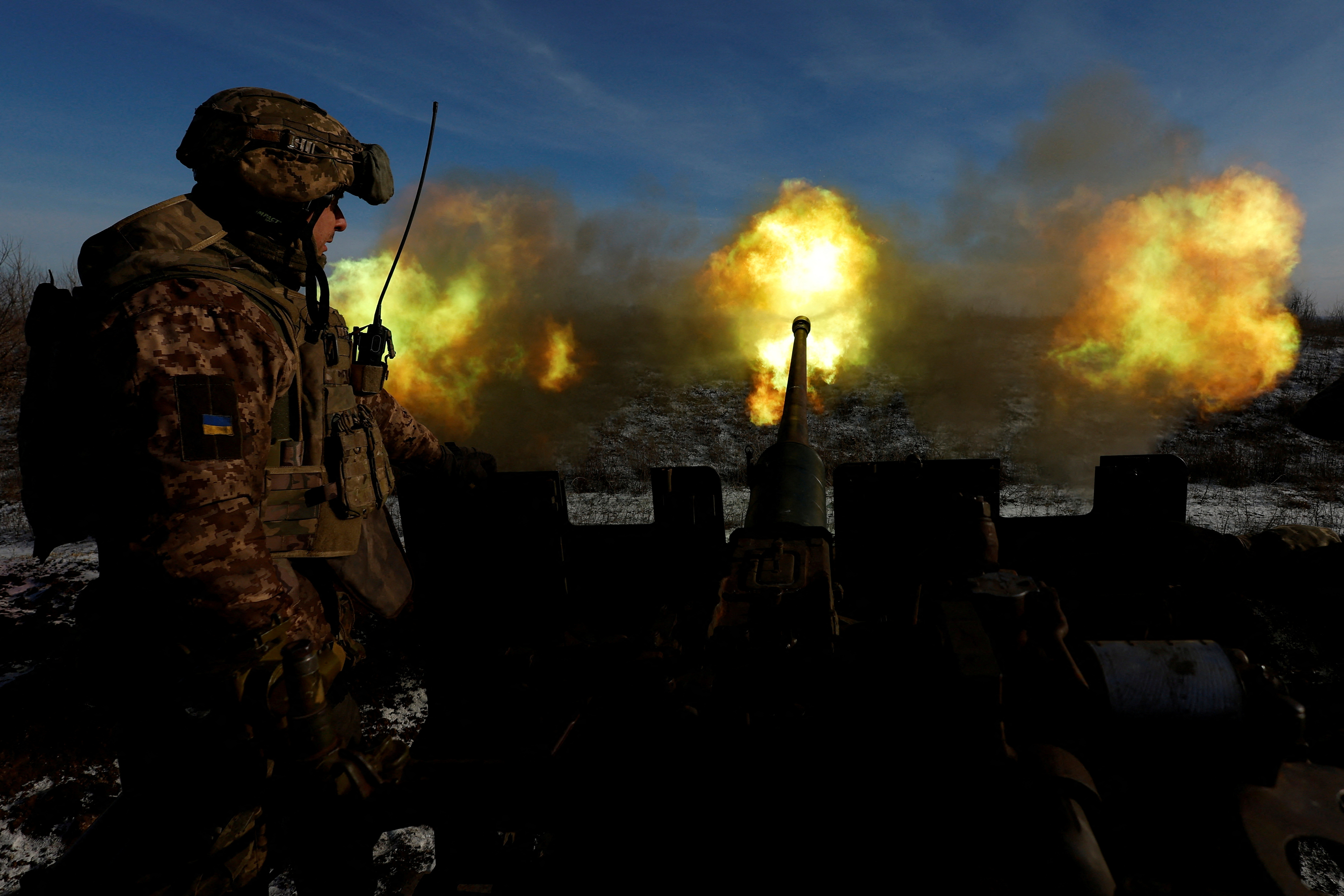 Ukrainian members of the military fire an anti aircraft weapon, in Bakhmut