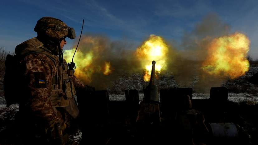 Ukrainian members of the military fire an anti aircraft weapon, in Bakhmut