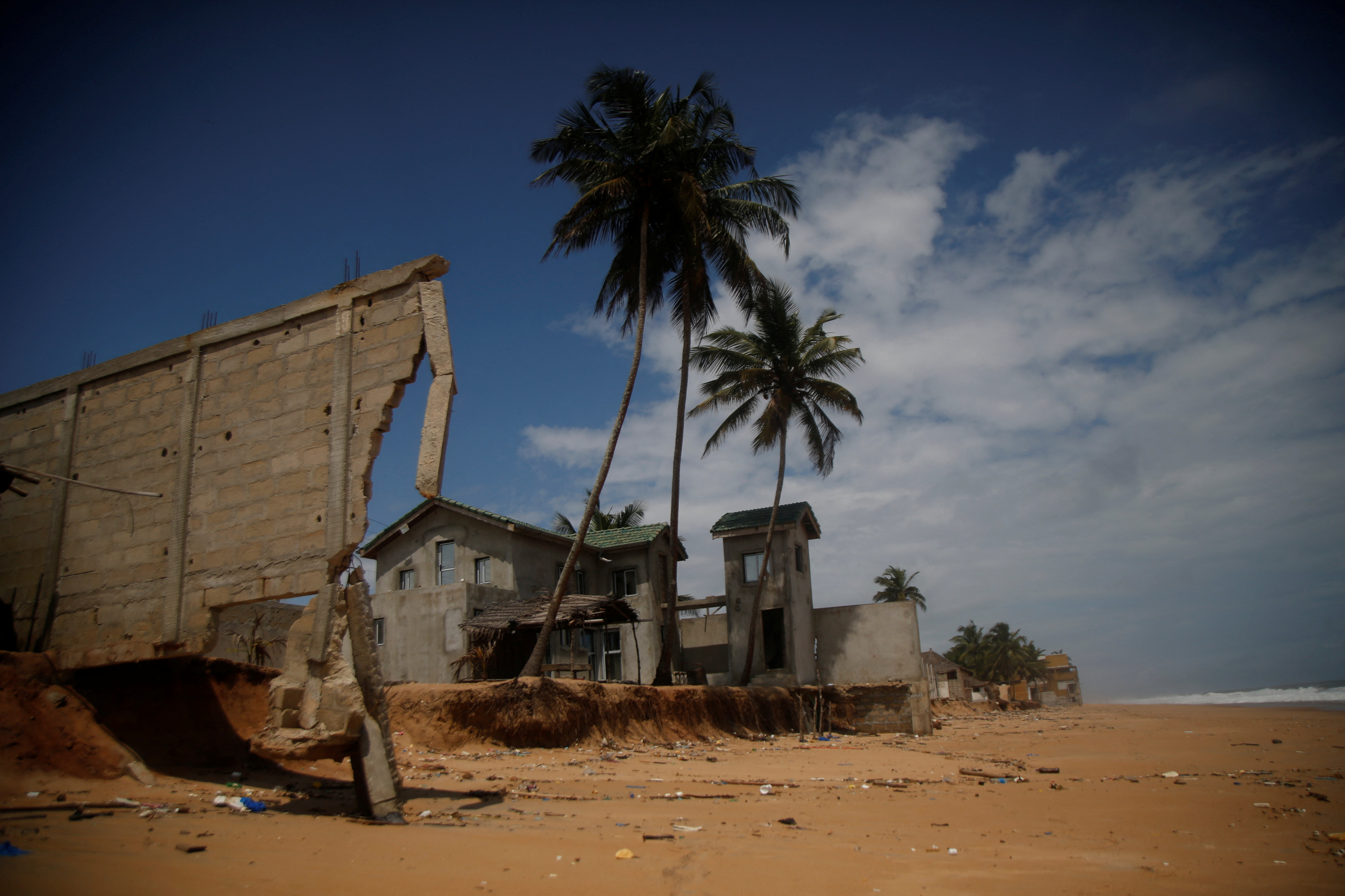A sudden rise in water level damages hotels and houses in the coastal towns east of Abidjan