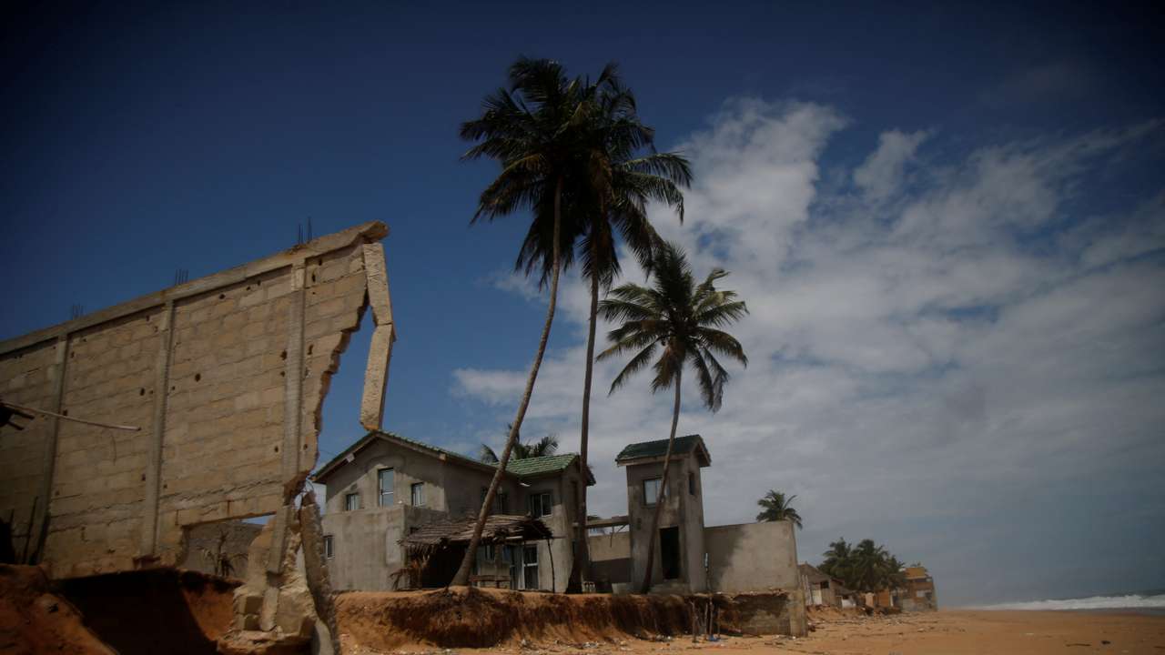A sudden rise in water level damages hotels and houses in the coastal towns east of Abidjan