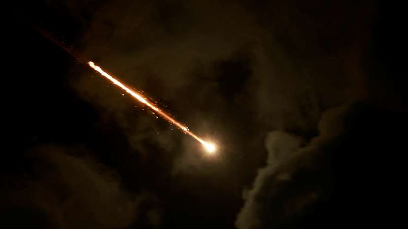 A projectile is seen in the sky after Iran fired a salvo of ballistic missiles, amid cross-border hostilities between Hezbollah and Israel, as seen from Tel Aviv