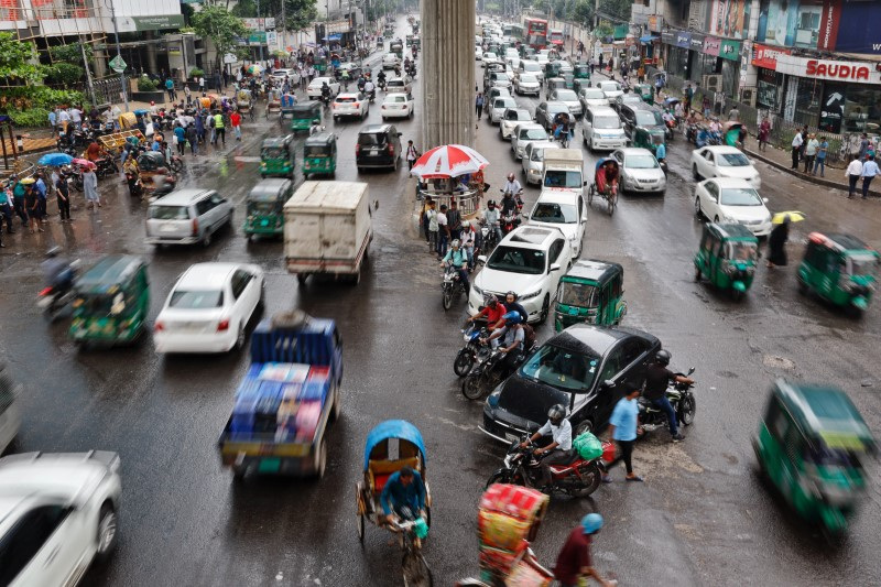 Vehicles move along the streets at Banglamotor intersection as situation improves following the resignation of former PM Hasina, in Dhaka