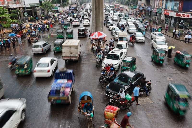 Vehicles move along the streets at Banglamotor intersection as situation improves following the resignation of former PM Hasina, in Dhaka