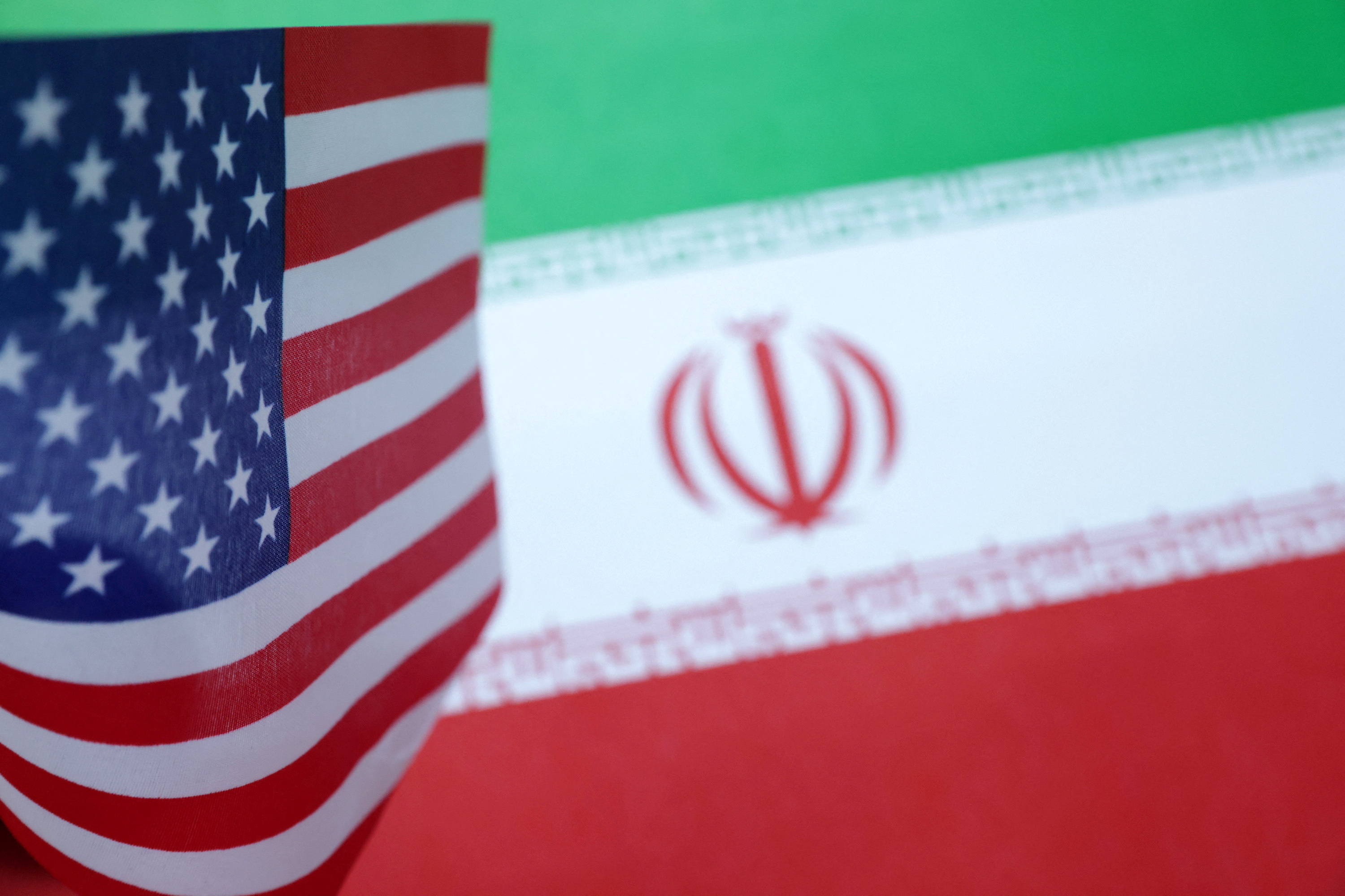 Illustration shows U.S. and Iran flags