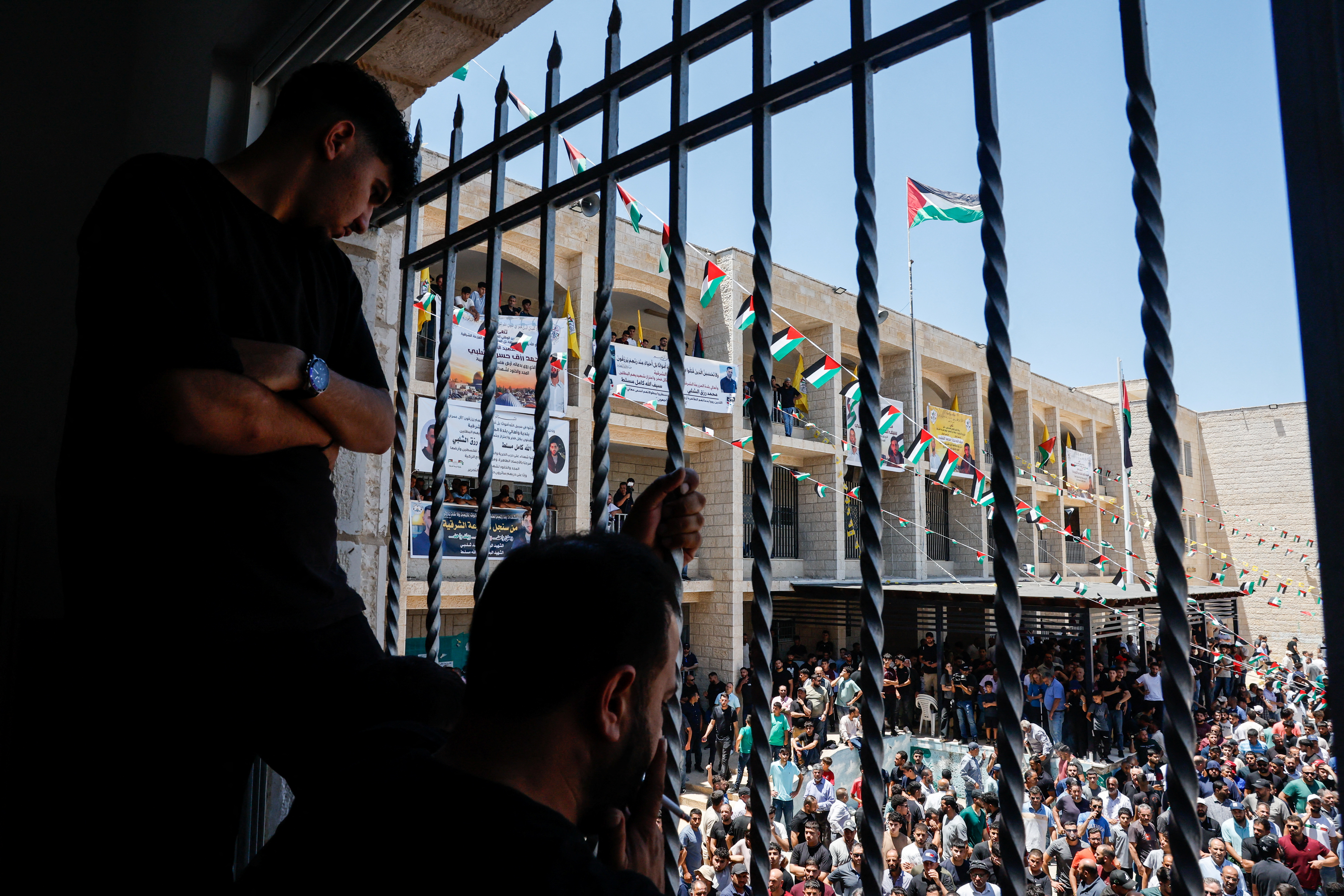 Mourners take part in the funeral of Sayfollah Kamel Musallet, killed amid the Israel-Gaza conflict, near Ramallah