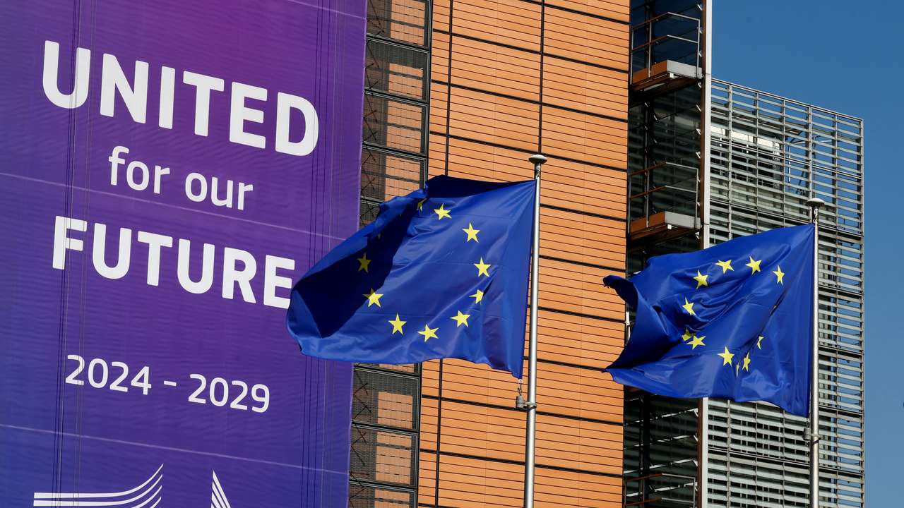 European Union flags flutter outside the European Commission headquarters in Brussels