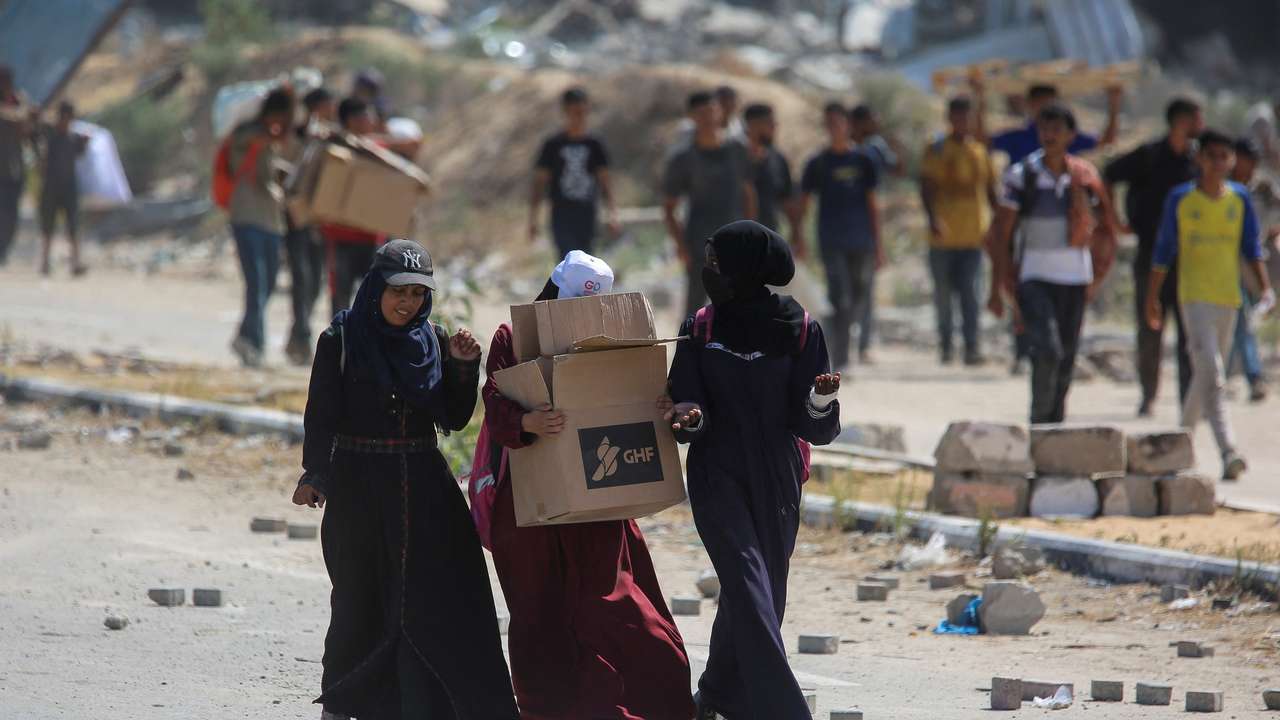 Palestinians seek aid supplies from the U.S.-backed Gaza Humanitarian Foundation (GHF), in the central Gaza Strip