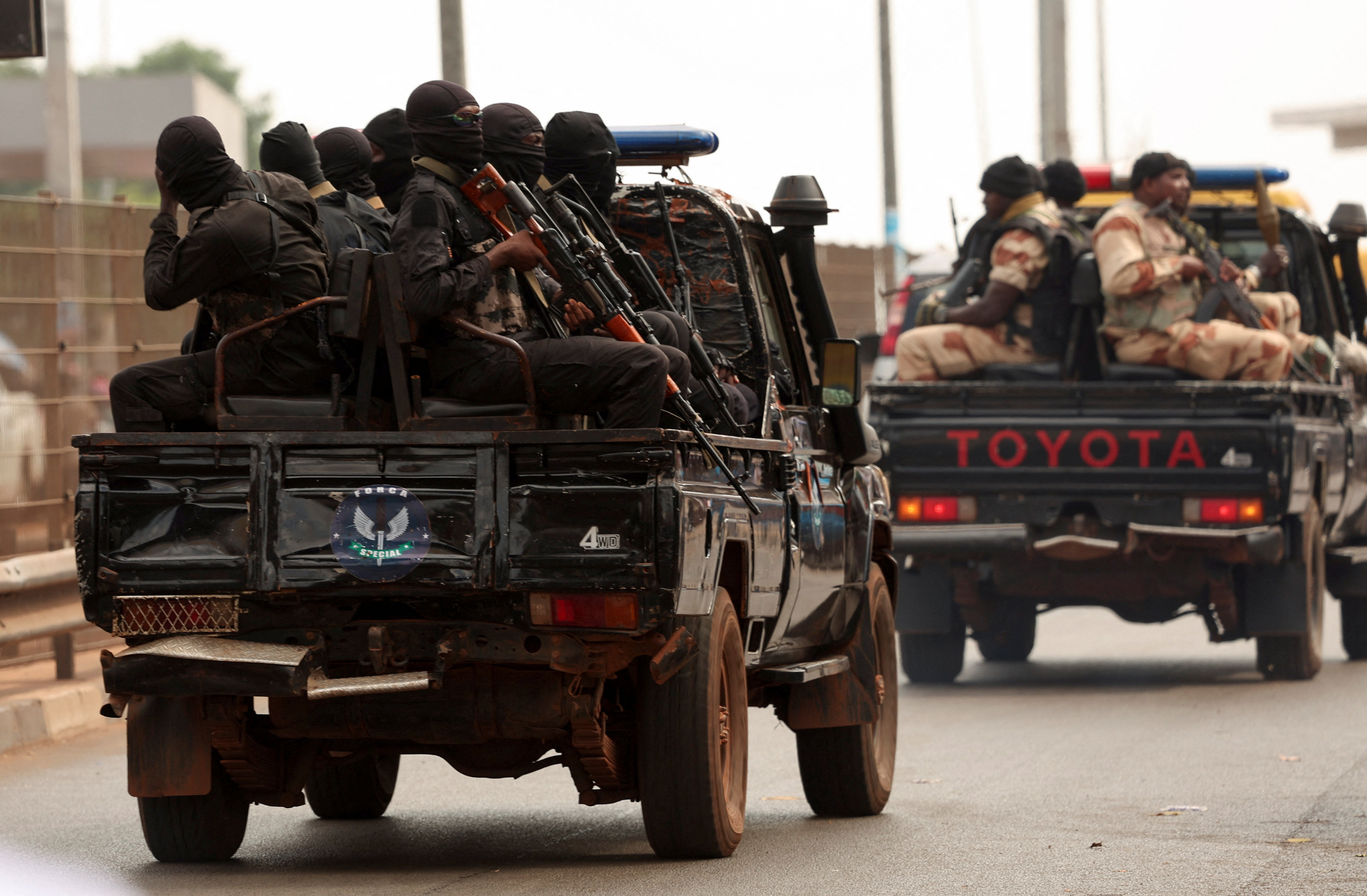 Soldiers patrol on the main road in Bissau