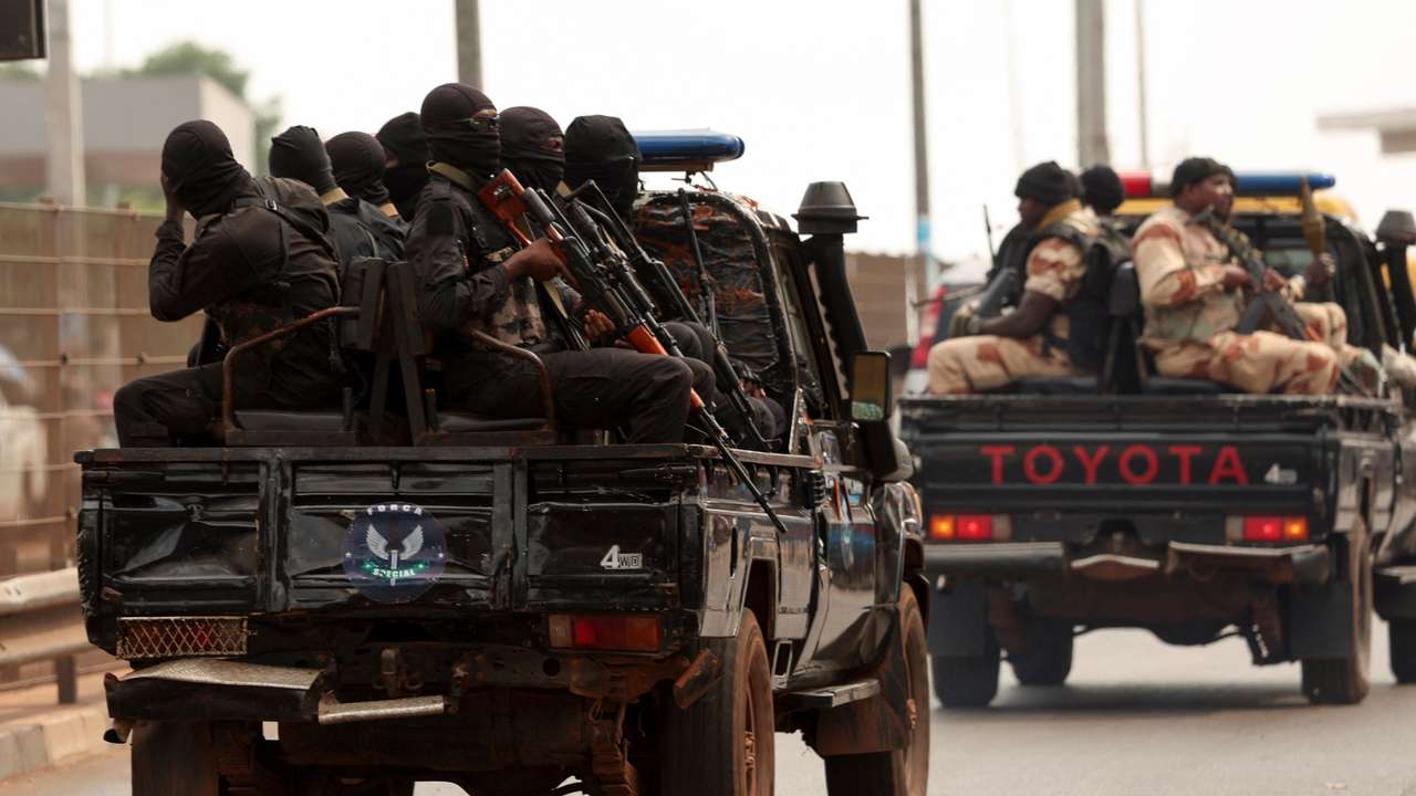 Soldiers patrol on the main road in Bissau