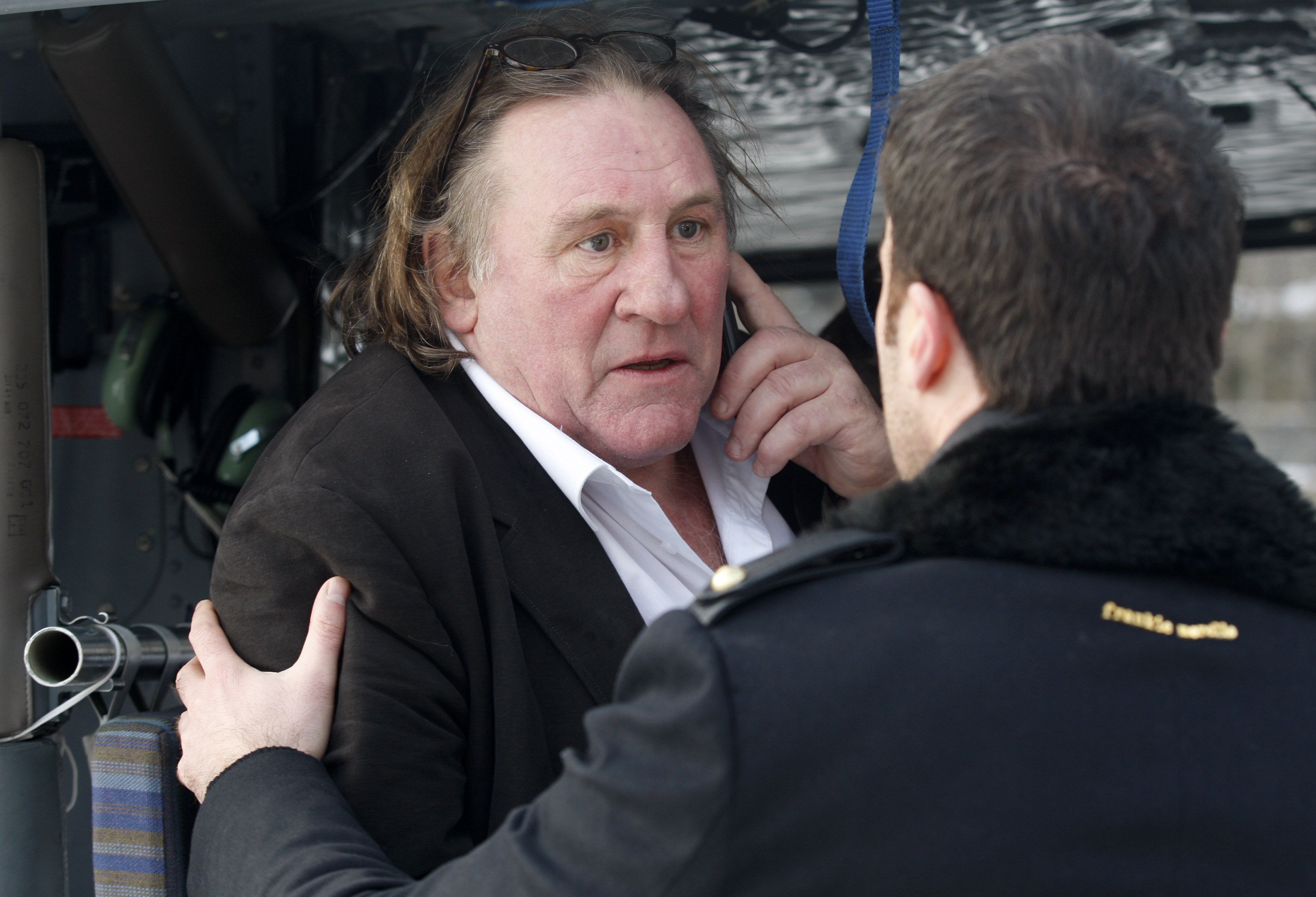 French actor Depardieu  talks on the phone after visiting Cetinje