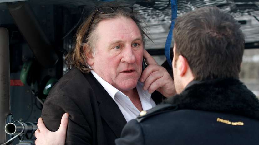 French actor Depardieu talks on the phone after visiting Cetinje