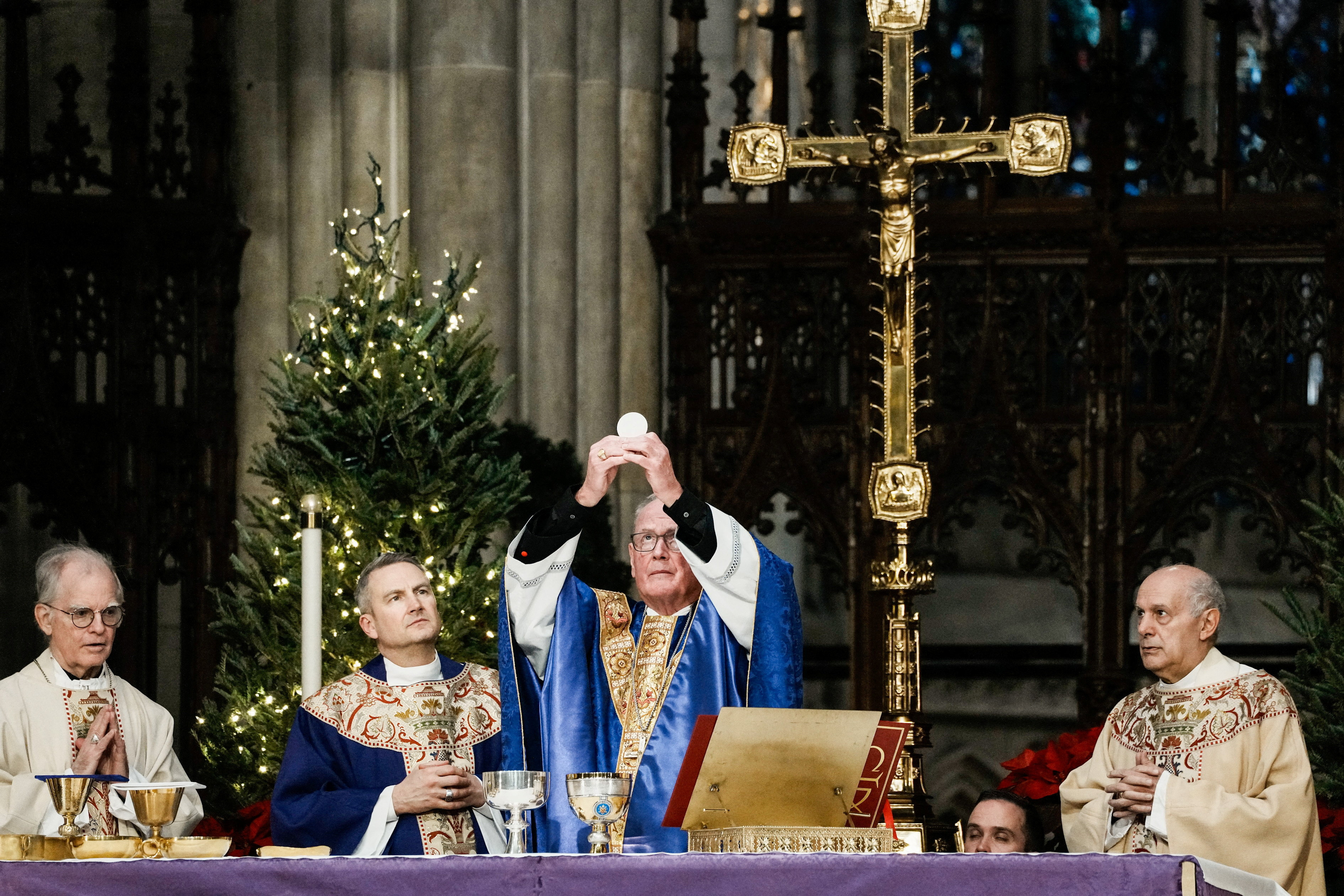 Archbishop-designate Ronald Hicks and Cardinal Timothy Dolan, outgoing Archbishop of New York, attend Mass at St. Patrick’s Cathedral, in New York