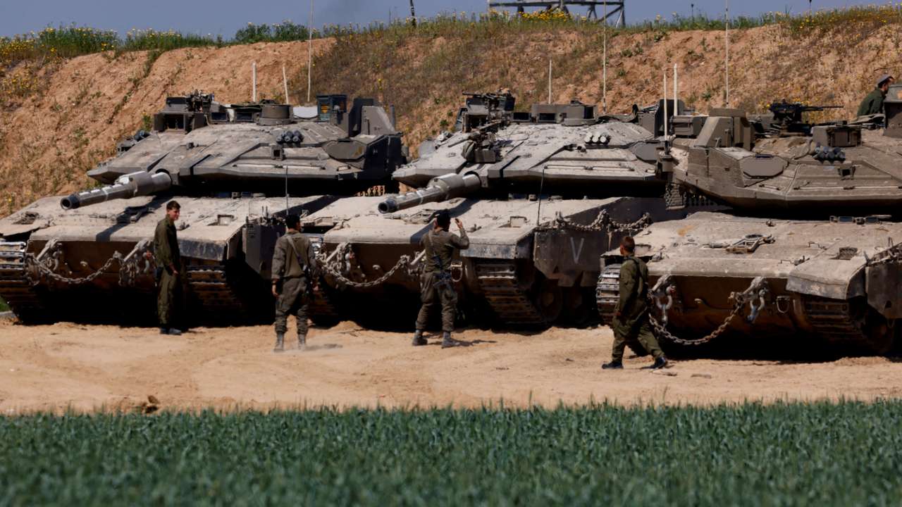 Israeli tanks are positioned near the Israel-Gaza border