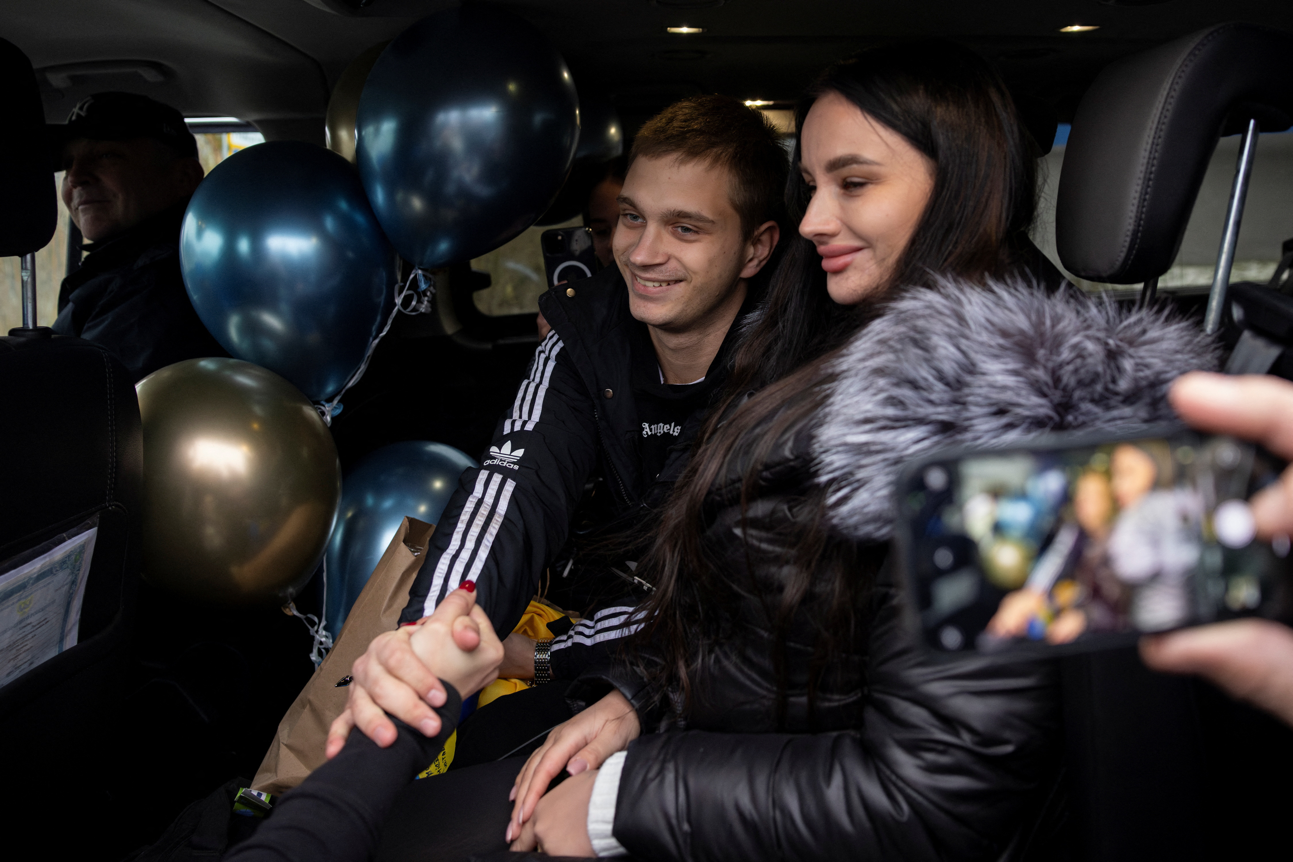 Ukrainian teenager Bohdan Yermokhin returns to Ukraine at the border crossing in Kortelisy