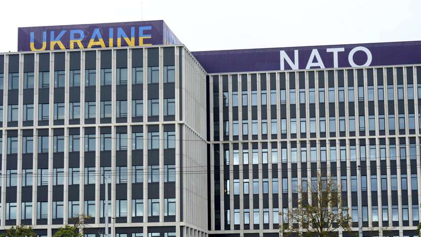 Ukraine and NATO signs are seen on a building in Vilnius