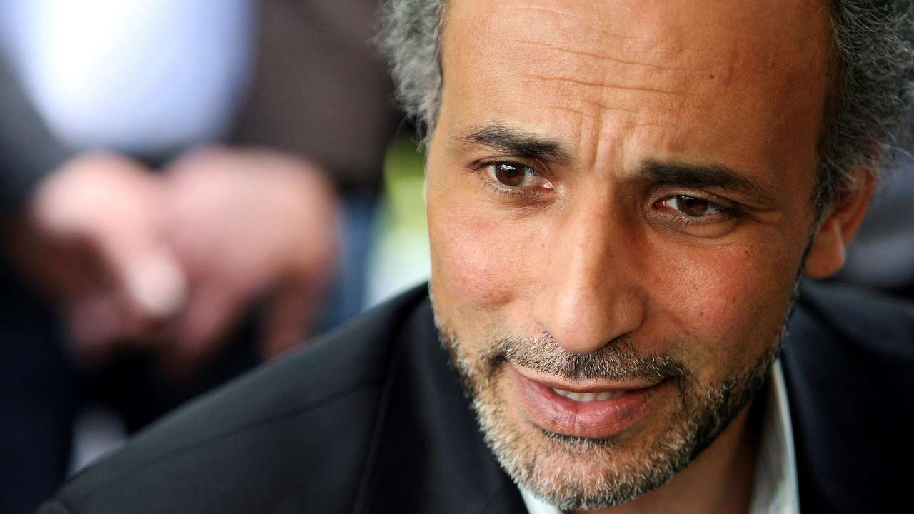 FILE PHOTO: Author Tariq Ramadan talks with a journalist after a conference at the Er-Rahma mosque in Nantes