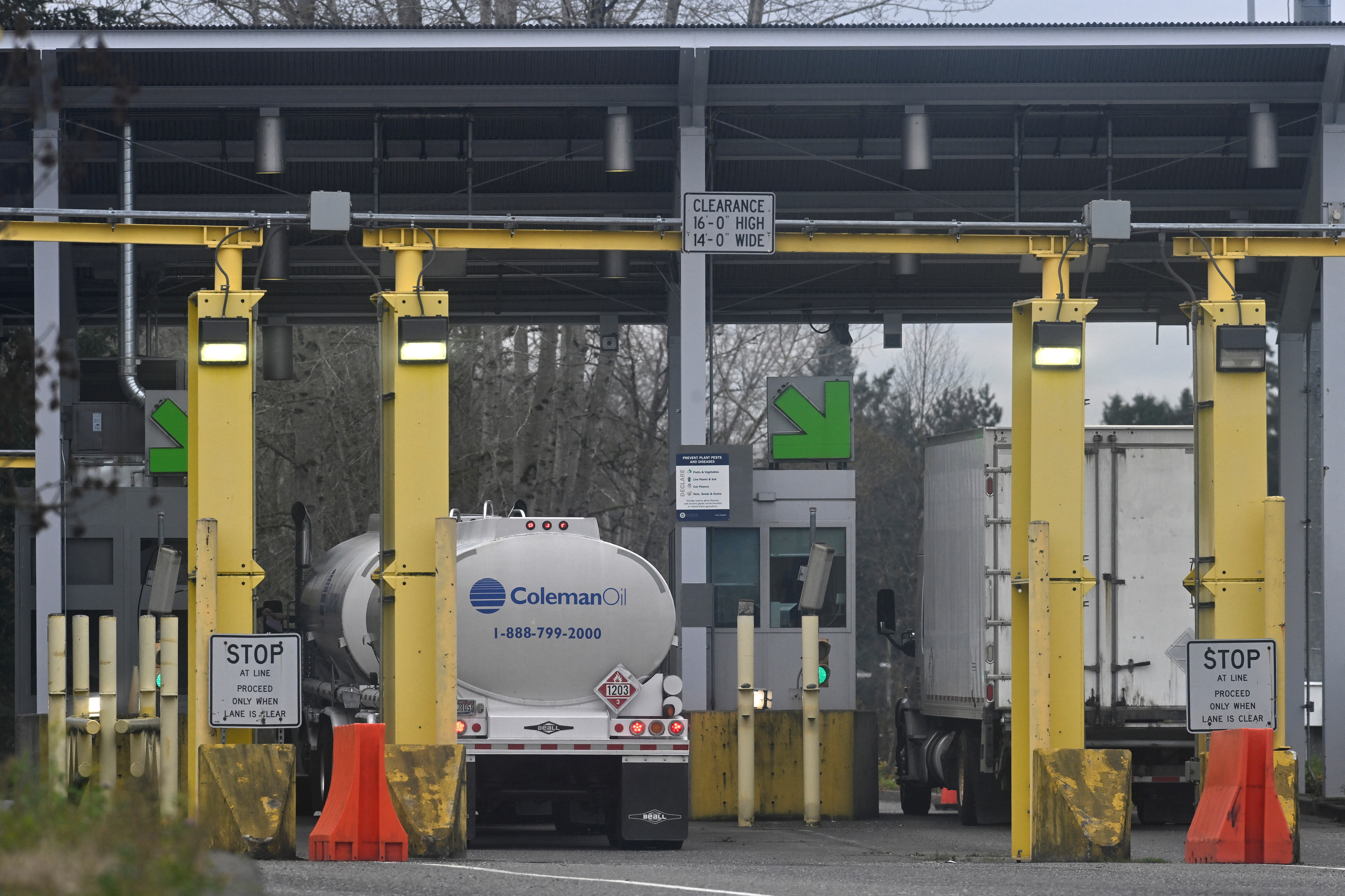 Commercial trucks head from Canada towards the U.S. Customs and Border Protection (CBP) Pacific Highway Port of Entry