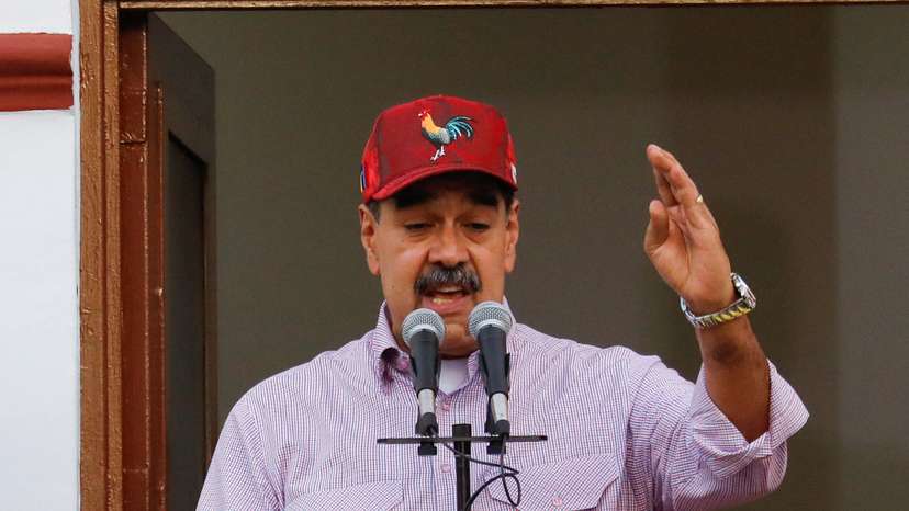 Venezuelan President Nicolas Maduro addresses supporters during a march marking the first anniversary of his victory in the disputed July 28 presidential election