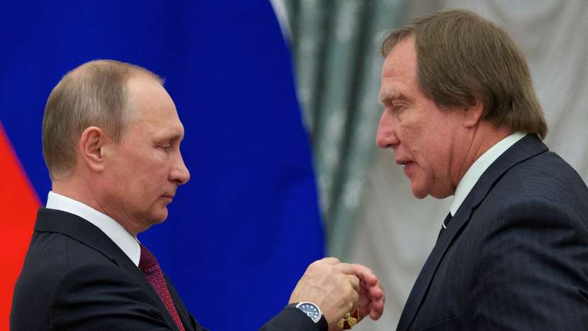 FILE PHOTO: Russian President Putin awards Sergey Roldugin during a ceremony at the Kremlin in Moscow
