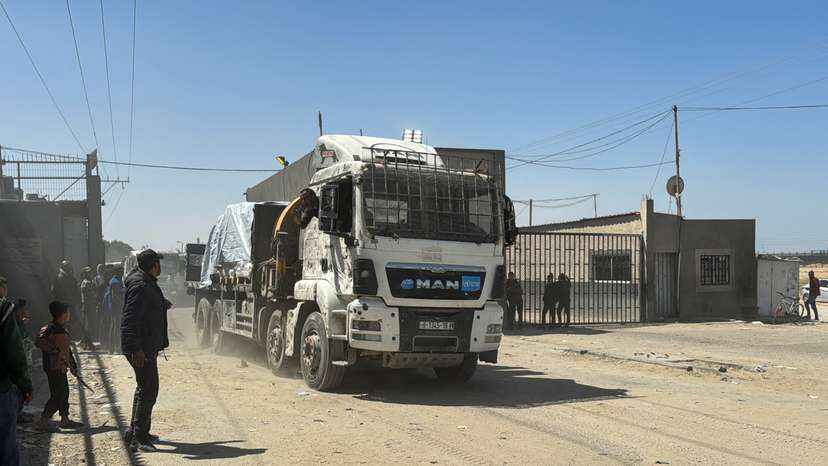 A truck carrying aid enters Gaza via Kerem Shalom crossing, amid the ongoing conflict between Israel and Hamas, in Rafah in the southern Gaza Strip