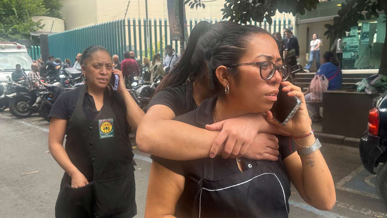 People wait outside their homes and buildings in Mexico City