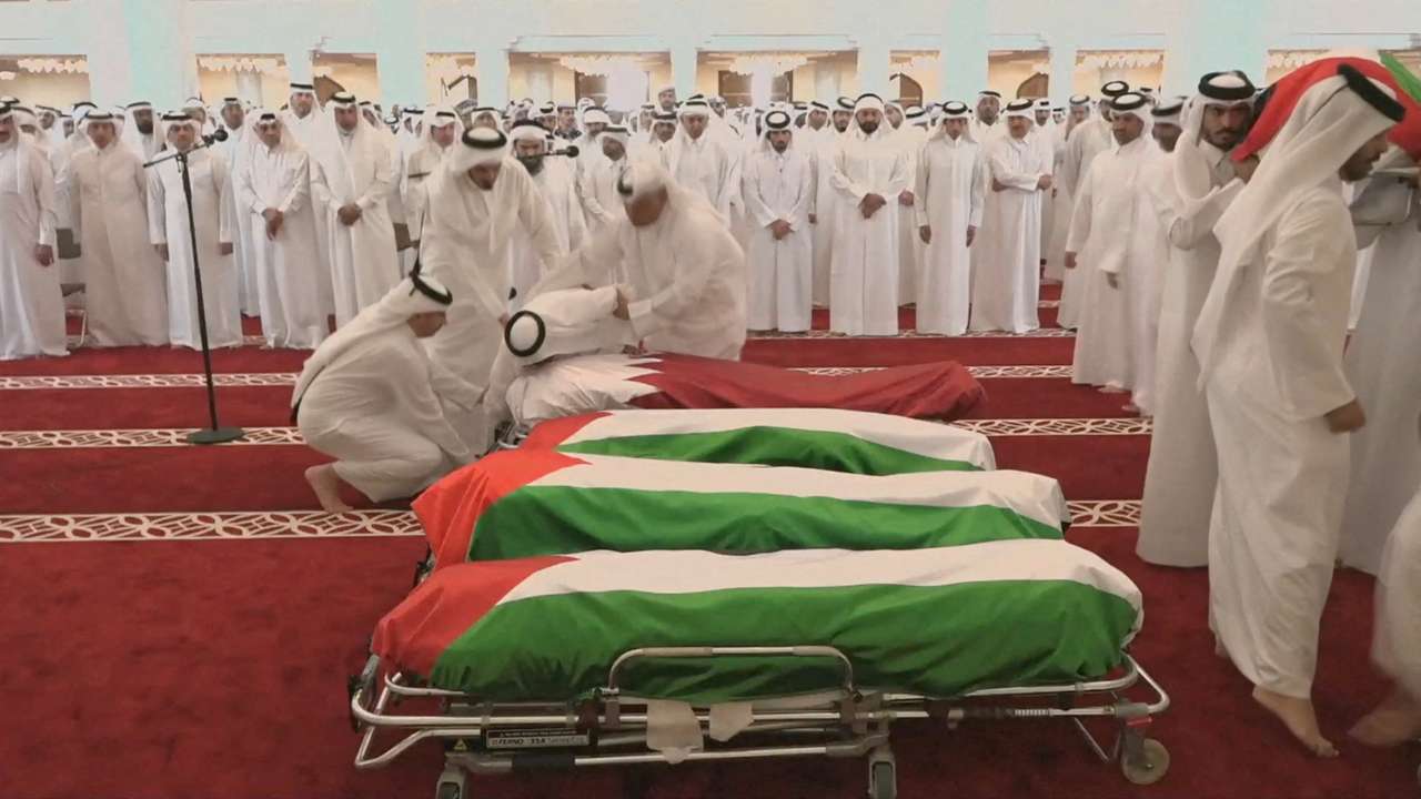 FILE PHOTO: People attend a funeral held for those killed by an Israeli attack in Doha