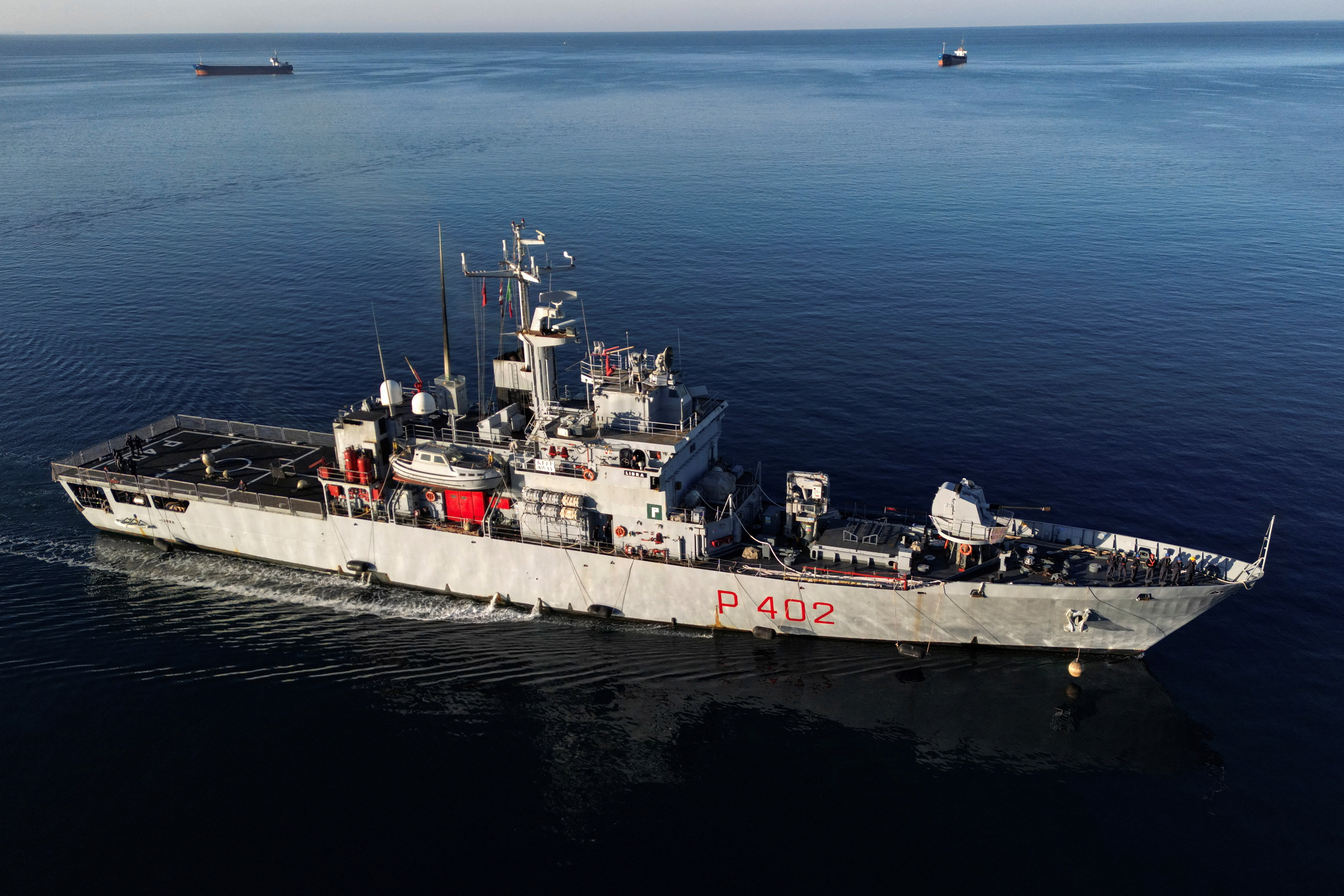 A drone view of the Italian navy ship Libra carrying migrants arriving in Shengjin