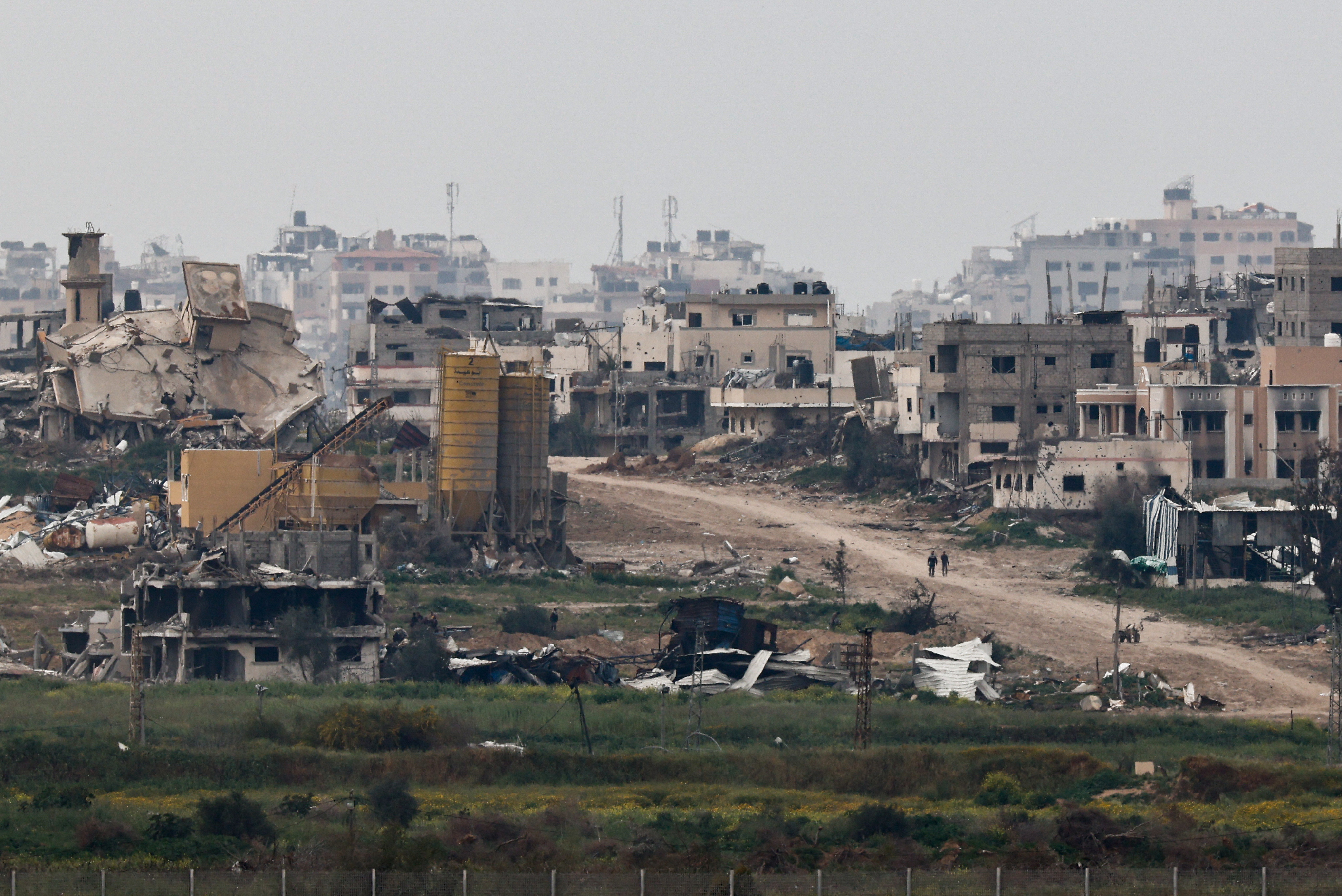 People walk in Gaza as seen from Israel