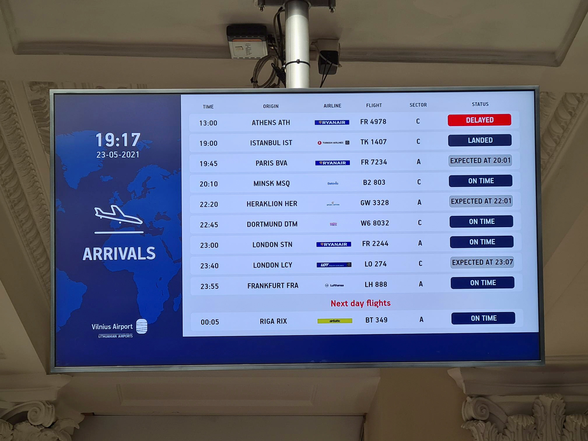 An information board showing international arrivals is pictured at Vilnius Airport, in Vilnius