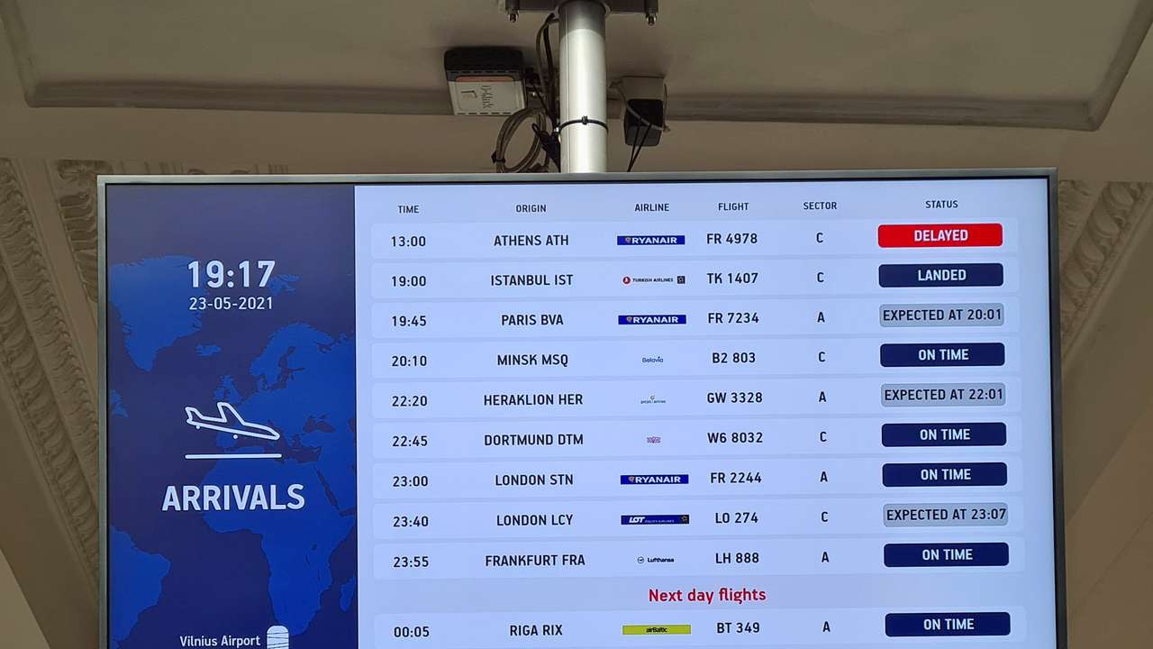An information board showing international arrivals is pictured at Vilnius Airport, in Vilnius