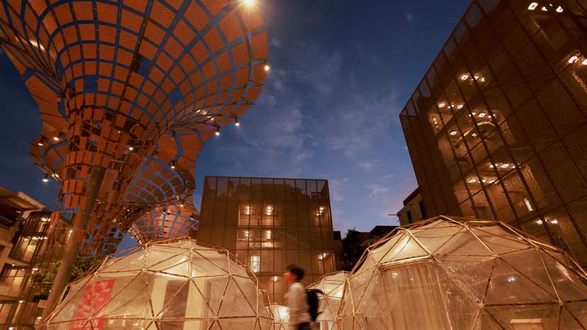 FILE PHOTO: A man walks past a pollution pod designed to mimic the air quality in New Delhi, during the United Nations Climate Change Conference (COP28), in Dubai