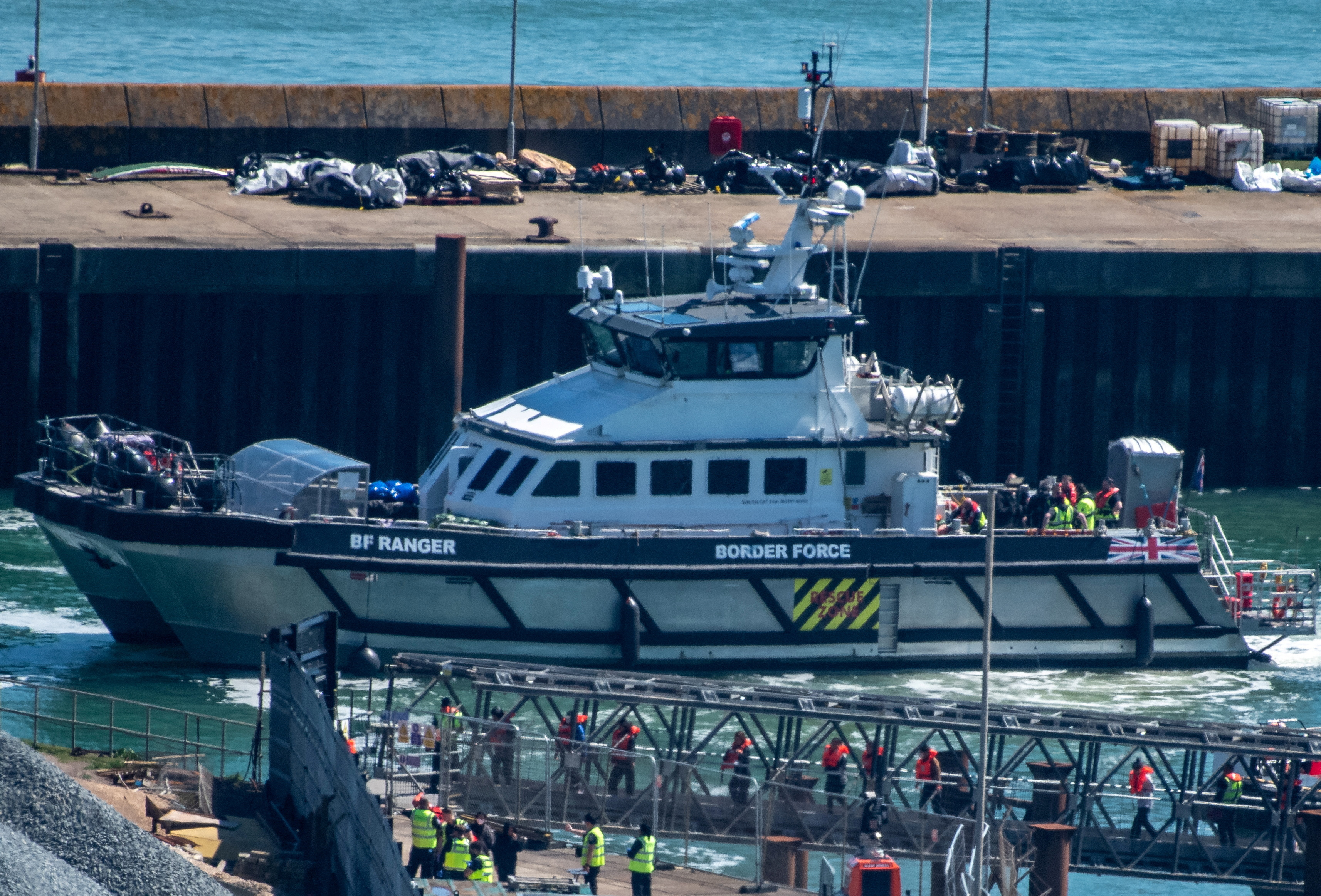 FILE PHOTO: Migrants arrive in the UK after crossing the English Channel