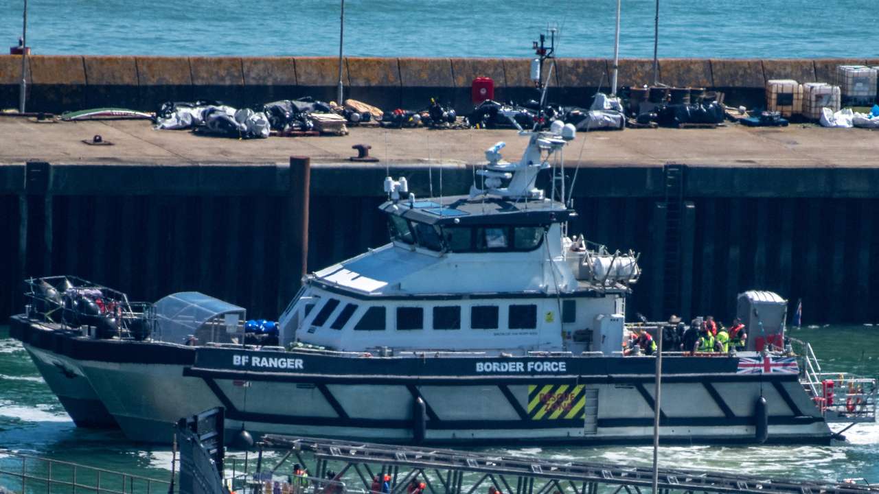 FILE PHOTO: Migrants arrive in the UK after crossing the English Channel