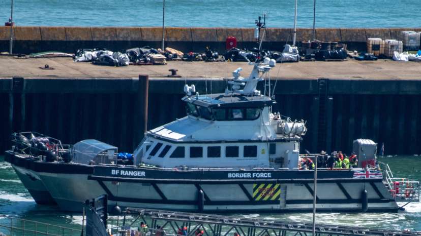 FILE PHOTO: Migrants arrive in the UK after crossing the English Channel